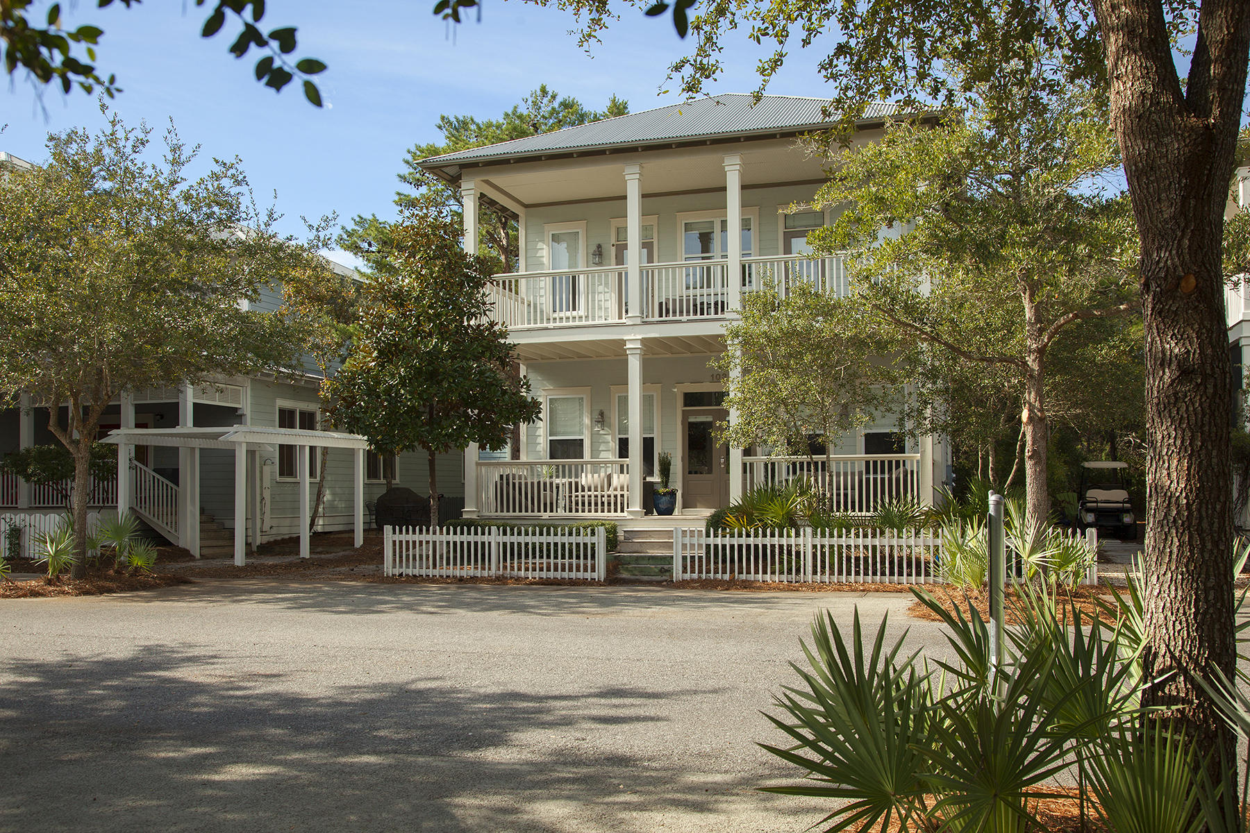 Inviting porches overlooking tranquil, tree-lined Ryan Street south of Scenic Highway 30A are every bit as comfortable as the airy interiors of this Seagrove Beach home. Wood floors are the stage for open concept living on the first floor. Chic cottage furnishings are a recent addition and convey for a truly turn-key purchase of an already successful vacation rental. Located in the neighborhood of Summer's Edge, you and your guests will enjoy two community pools, one of which is heated seasonally, as well as beach access and excellent proximity to Seaside Central Square, just over two miles to the west. Guests will gravitate to the modern kitchen with bar seating for four, appointed with granite counters and stainless steel appliances. Three bedrooms that include a serene master with spa