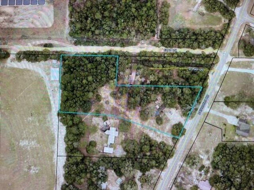 Great piece of property located near central Crestview on the East side. Spacious 2.41 acre lot with paved road access (frontage) on Fairchild Rd and dirt road access on Elks Lane at the rear of the property. The lot has both power and water access. Perfect for a new single family home build, manufactured, or mobile home as well. Lots of space to enjoy and can easily accommodate RV, boats, pool, workshop and more. Build to suit or hold onto it for investment property. Schedule your showing to see this property today!