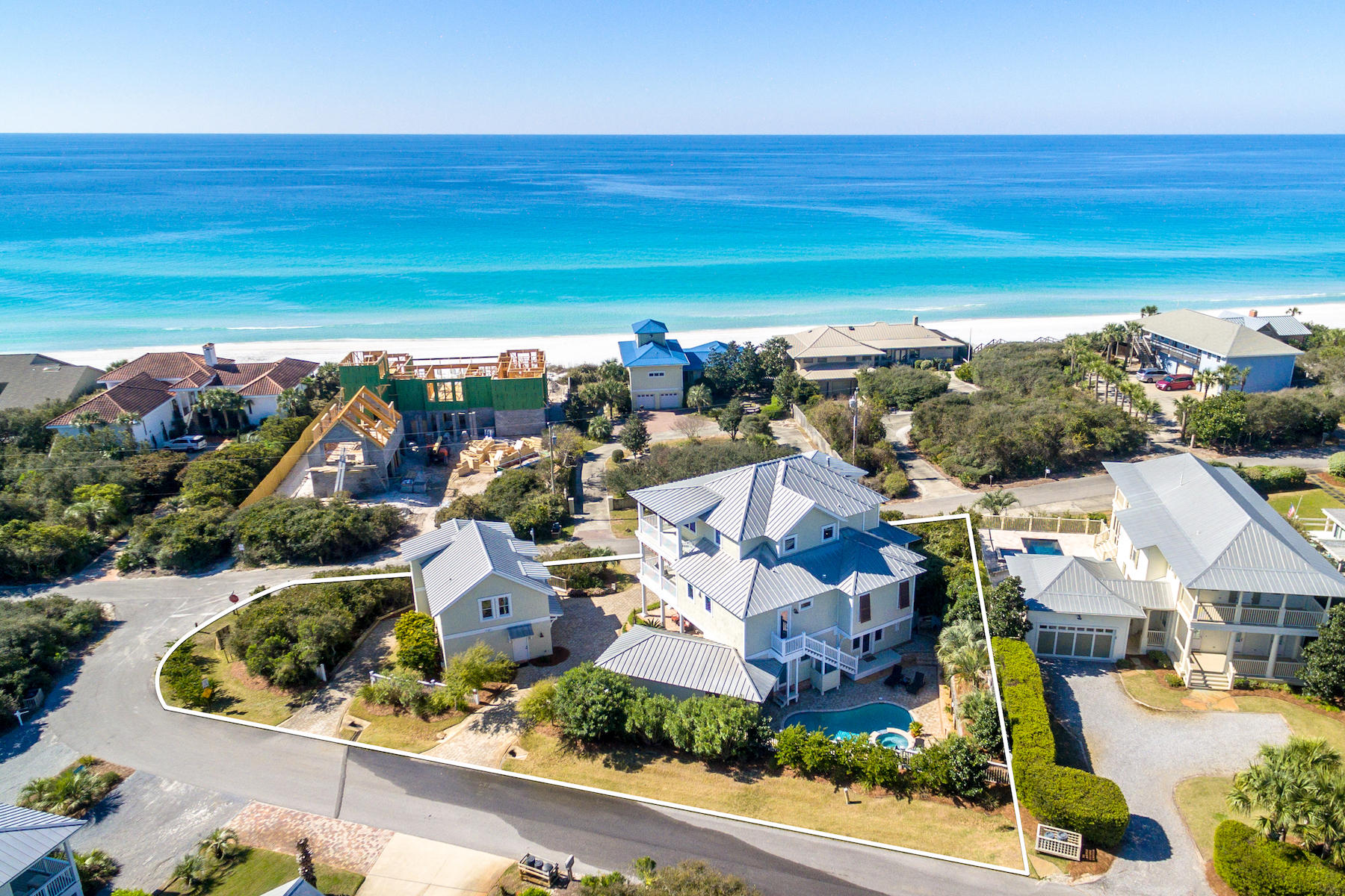 $250,000+ updated rental projections on this Custom Home with expansive Gulf views on the market for the first time ! Outstanding investment play or perfect primary or second home. Quiet beach access is directly across the street, exclusive to Beach Highland owners, 30A's best kept secret! The double lot estate boasts a private pool with spa, covered cabana and separate Carriage House. Entertain guest and large families comfortably in the open living room expanding out to wrap-a-round porches with Gulf views! ABUNDANT PARKING... Enjoy 3 garage spaces +golf cart space, and two driveway cuts. Quality construction and attention to detail are top notch-long list of custom features and finishes! Whole house background music/Sonos and a 3-stop elevator are a few extras. No HOA dues.