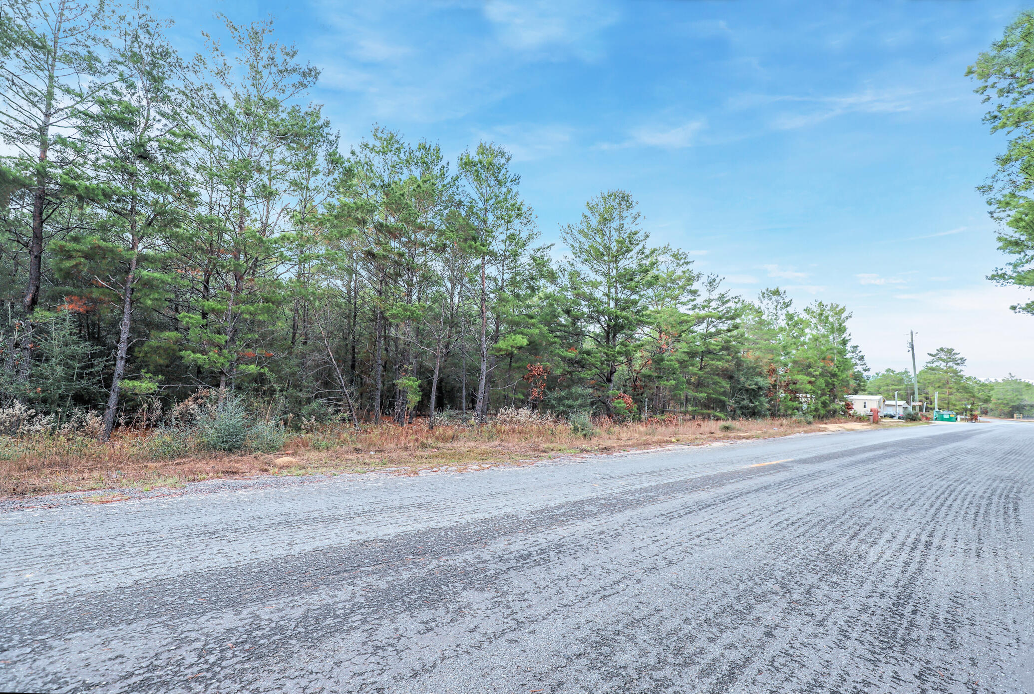 GREAT LOCATION! With easy access to main highways, less than 1 mile away from HWY 90. Mobile homes allowed. This property comprises of 28 lots that could be split or grouped into smaller parcels. (Please check County and Heath department regulations if you are planning to split the lot)Vacant wooded lot 1.6 acres in size, level, high and dry and NOT in a flood zone. There are no utilities in place. Power: Available in the area. Water: Would be by private well. Sewer: Would be by Septic. Claim your piece of Florida land!