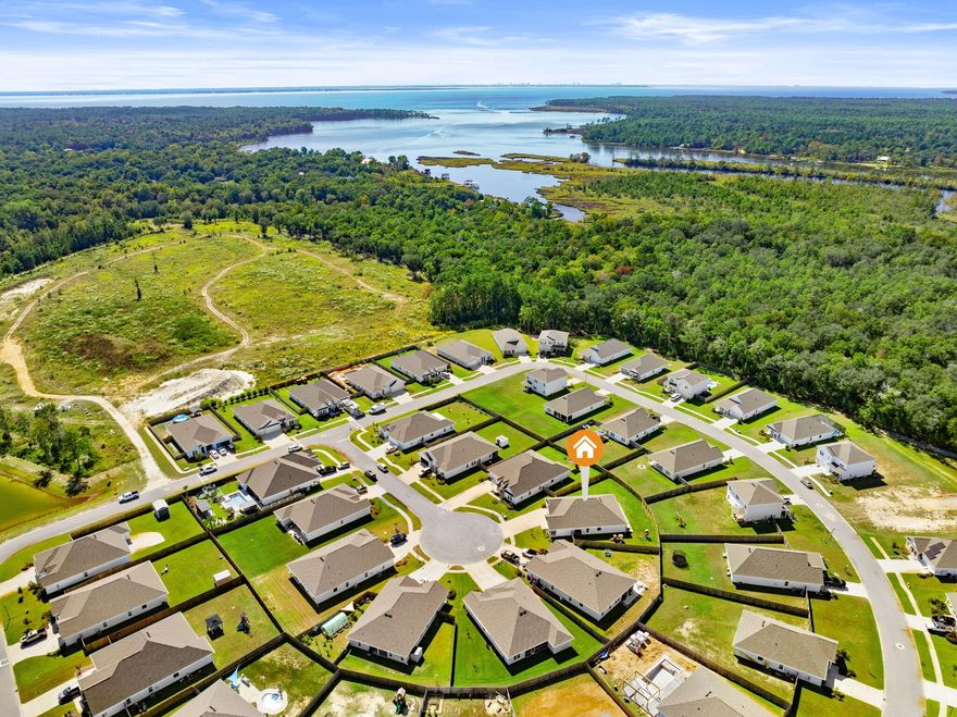 Discover the perfect blend of comfort and convenience in this charming 4-bedroom home located in the heart of Freeport. Situated on a peaceful cul-de-sac, this property offers an idyllic lifestyle with easy access to all Freeport has to offer.  This home offers a 3 car garage and a sizeable open floor plan featuring a large living room with natural light that flows into a kitchen featuring quartz countertops, stainless steel appliances and cozy island.This home is setup for the ultimate entertainment spot for your family and friends. Step outside into the screened in porch with sealed concrete, plus a large extended concrete patio for additional sun or spending your evenings watching the amazing sunsets or relaxing in your private, fenced backyard.  The master ensuite features dual vanity sinks, a separate glass-door shower, garden tub and large walk-in closet.  The three secondary bedrooms offer sufficient space and separation with two additional full bathrooms for the family or guests.  Enjoy your evenings on the cul-de-sac with your covered patio and luscious landscaping offering great curb appeal. Located just a quick drive from the Emerald waters of the Gulf and within a short distance from many boat launches into the Choctawhatchee Bay for your on water entertainment.  