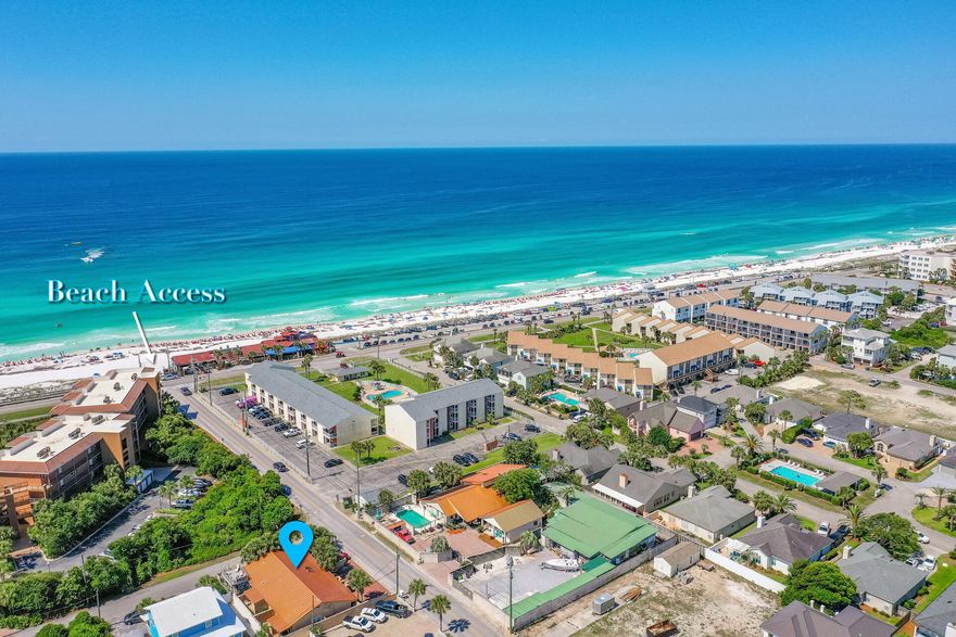Location, location, location and NO HOA!This 2 bedroom 2 bath patio home Is located close to the Gulf of Mexico and just steps away from Pompano Joe's and the beach access. The kitchen was recently updated and the interior painted, along with a full bath added.  The location is prime for short term rental, long term rental, vacation home or a primary residence.