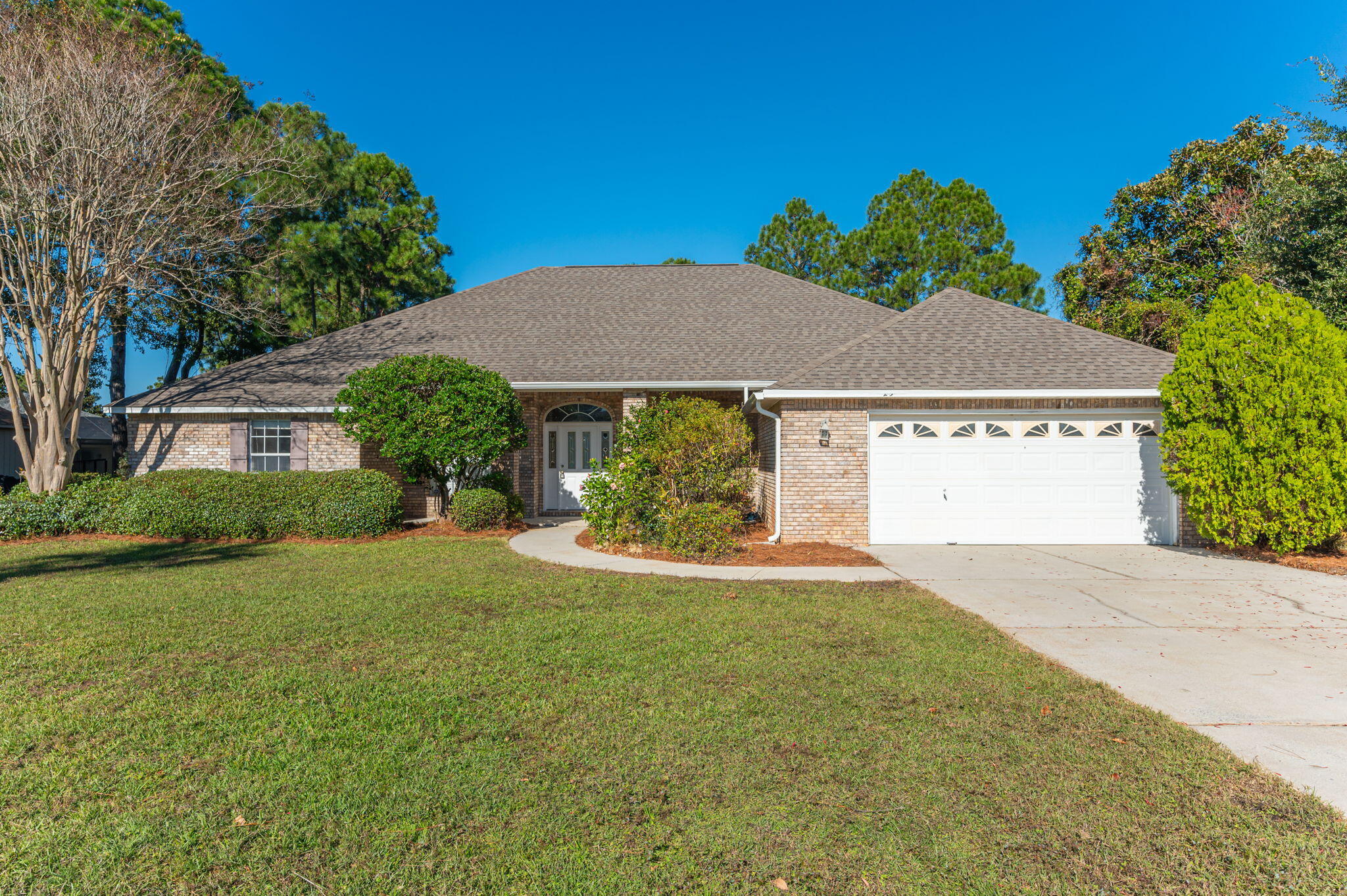 Welcome to your Beautiful home in the gated community of Bay Wind's Golf Estates. One of Destin's friendliest and safest neighborhoods in the area. This spacious 2584 Square Foot Contemporary Rancher boasts a popular open floor plan perfect for entertaining. Enjoy your own Private Pool and enormous backyard. It's a gardener's paradise filled with exotic plants, or the perfect playground for children. For 3 BR, 2.5 Bath house built in 1998 has a large master suite with walk in closet. Priced to sell to the family who'd like to put their own personal touches on it. New Roof April 2021. Low HOA fees.