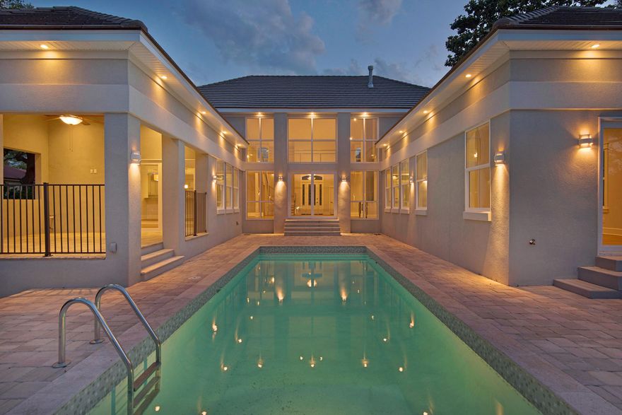 WOW! Talk about a transformation! Total renovation and remodel is complete! Great location on coveted deep water bayou in desirable Indian Bayou! Once a single story, 2,734 square foot home, now boasting 4,037 square feet with a whole new second level addition. Great curb appeal, with a brick paver driveway, entry doors opening in to a large foyer and open great room with soaring cathedral ceilings and a wall of windows overlooking the sparkling pool and bayou. Open concept living area, gourmet kitchen with granite counters, custom quiet close cabinetry, Thermadore professional grade 6 burner range and range hood, wine refrigerator, walk-in pantry, large breakfast bar and generously sized dining area. First level master suite with spa inspired bath, large walk-in closet with