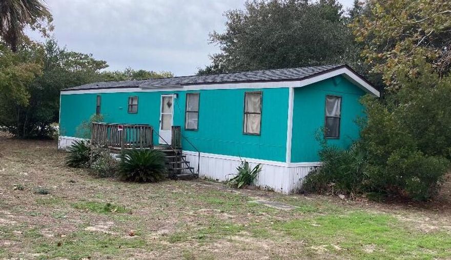 Back on the market and a rare opportunity - Large, corner lot, Golf cart community, Prestigious west end of PCB UNDER $200K!!! Buy and Hold or fix and flip. This is a fabulous opportunity to own at the Prestigeous west end of PCB.  Updates include water heater, AC, roof, and subfloors.  In need of paint and flooring otherwise good to go.