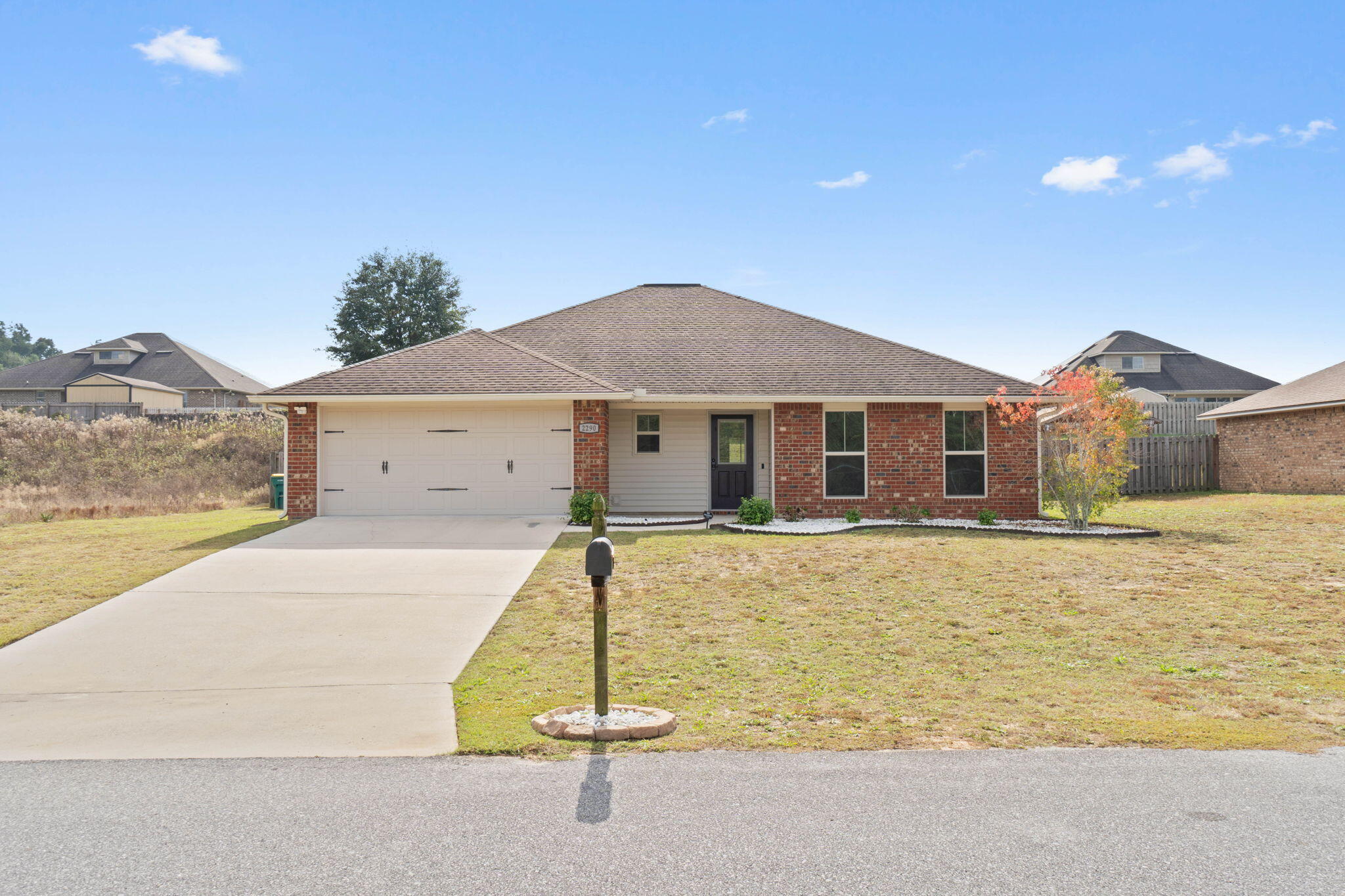 Welcome home to this 4 bedroom/2 bath home built in 2017 and located in the popular neighborhood of Lee Farms. This move in ready home was just freshly painted with new carpet last year in the bedrooms and living room and features hard surface flooring in all other spaces. You'll love the well appointed kitchen featuring granite countertops, stainless steel appliances, and upgraded cabinets. Additionally you'll enjoy the hop up breakfast bar creating separate spaces within this open layout and an eat in dining nook. Relax in your owner's suite in a spacious room with an en suite bathroom complete with double vanity granite countertops, a garden tub/shower combo, and a walk in closet. The other 3 bedrooms feature ceiling fans throughout and ample closet space. You'll love the large fully fenced in yard with plenty of space to create the entertainment space of your dreams. Lee Farms also includes a neighborhood playground. Located just north of Highway 90 and minutes from shopping and restaurants you'll love what this growing city has to offer just a short drive to Eglin AFB and near the beautiful beaches of the Emerald Coast.