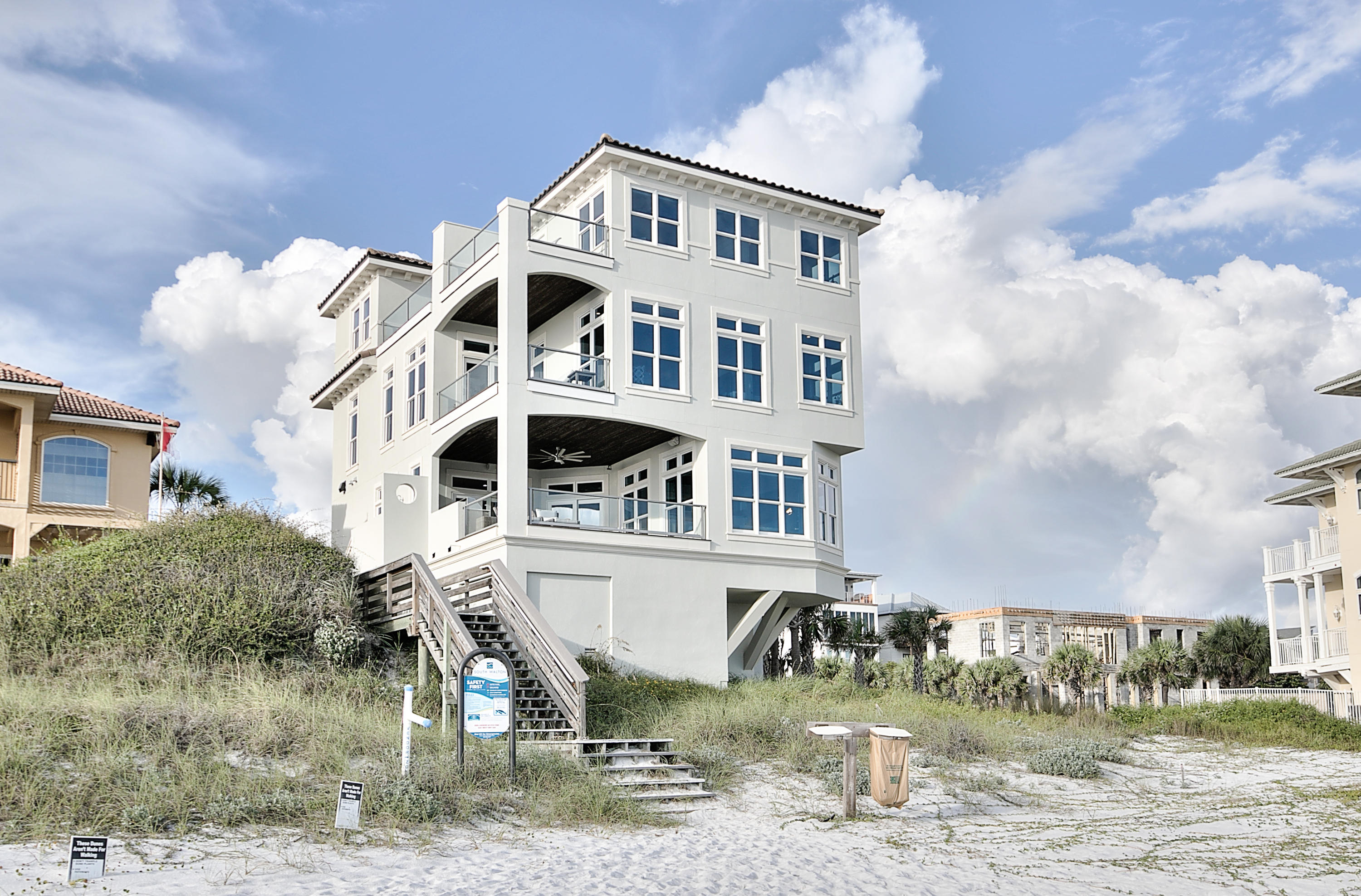 This unique Gulf front home fits seamlessly into the natural beauty of the Emerald green Gulf waters and our pristine white beaches. With 70 feet of Gulf front views and multiple porches and entertainment areas, this dramatic home offers enough room for your family and guests - merging the interior spaces with the natural surroundings. Classic beauty is combined with craftsmanship, quality products and modern amenities. In pristine condition and never been rented, this home is one of 4 homes on a private, gated street and within a short distance to Gulf Place and all 30A has to offer. 6 Bedrooms, 3 porches, views from every room, elevator, 2 car garage and enormous storage area under the house, guaranteed to meet your every need. Huge rental potential. Please see specifications