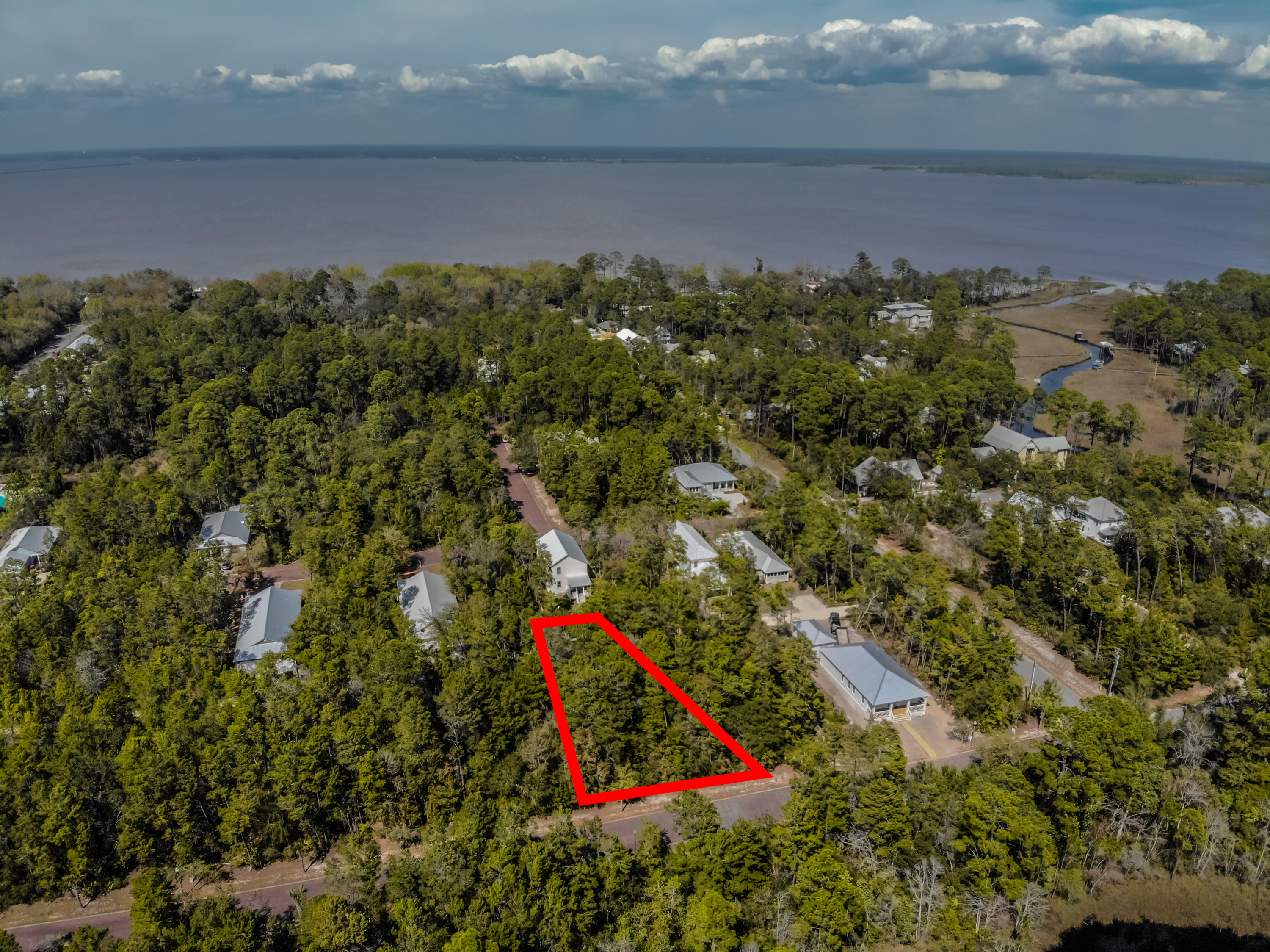 Great lot located in the quiet neighborhood of Magnolia Beach. One of the features that makes this lot so special is the alleyway that allows the house to have a rear entry garage. Build your home in this peaceful neighborhood with access to the bay and a community pool.