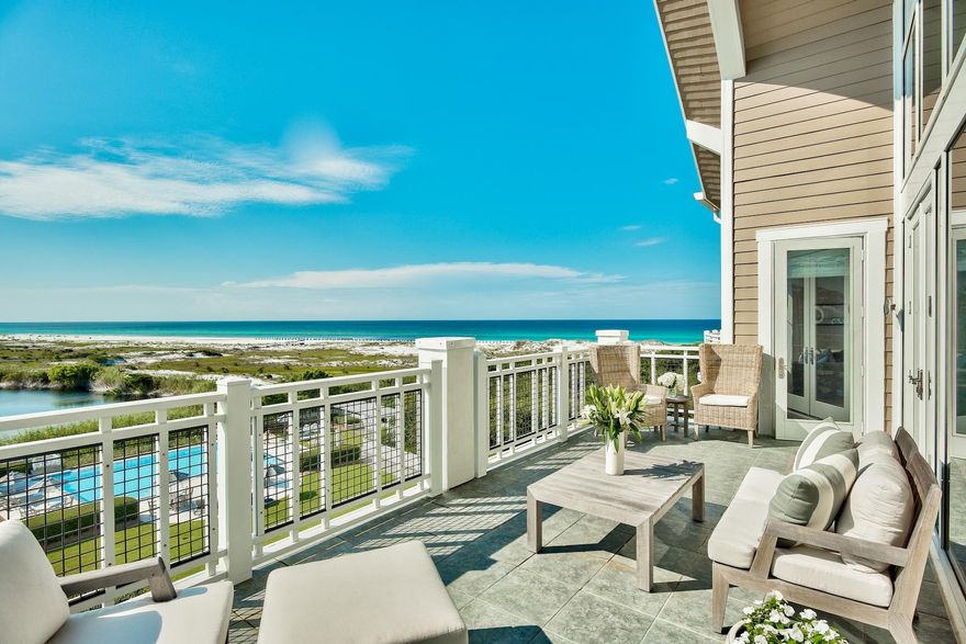 Watersound Beach is a serene community in a prime beachfront location, and this top floor unit provides a wonderful home for enjoying all that it has to offer. The far-reaching, ever-changing gulf and coastal dune lake views are best enjoyed from the generous balcony, welcoming the morning breeze or toasting the sunset with cocktails at dusk. Indoors, this exquisite 2,177 square feet, 3 bed, 3.5 bath condo is equally delightful. The bright and airy living room has 24-foot-high ceilings and equally impressive double-height windows framing glorious coastal views. It's a room to linger in, relax, read and entertain friends. French doors open onto the terrace, providing seamless indoor-outdoor living in the Florida sunshine.