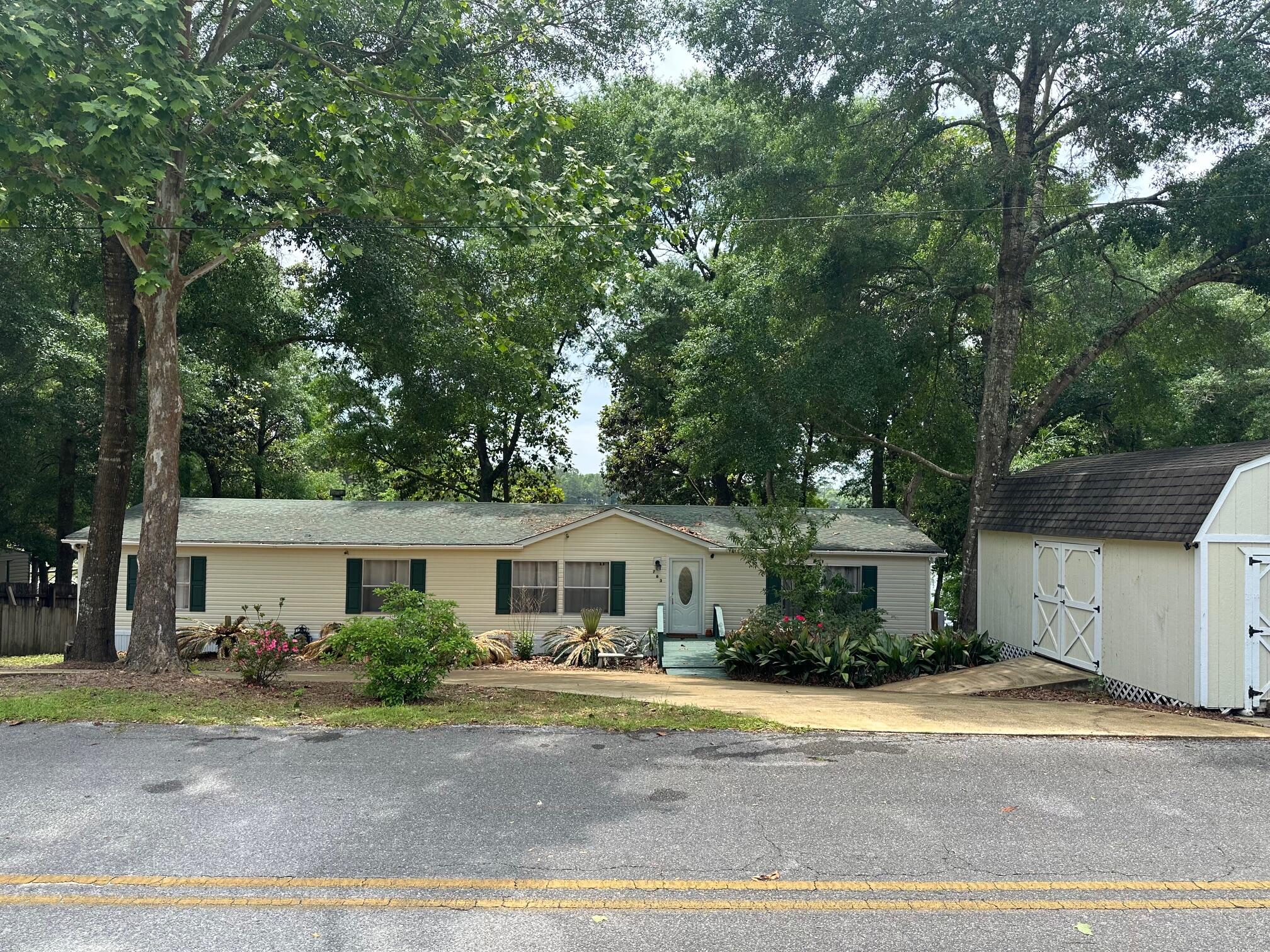 AWSOME PRICE IMPROVEMENT... LIVE YOUR BEST LIFE IN THIS BEAUTIFUL LAKERONT HOME!!This beautifully maintained home is ready to move in. Perfect for a family or retirees. Cat Island Park is minutes from the front door with a fishing pier and world class bass. You could launch your own kayak, canoe, or boat from your back yard. The home has been updated with all new vinyl plank flooring, new HVAC, and interior paint in 2023. New hot water heater, stainless appliances and deck was repaired and beautifully painted in 2024. Home is ready for you to watch the sunset over the lake or drink a cup of coffee in the morning while nature awakes. Two outbuildings offer plenty of storage for the fishing gear you will want to keep on hand. CHECK OUT VIDEO OF LAKE IN PHOTO SECTION.