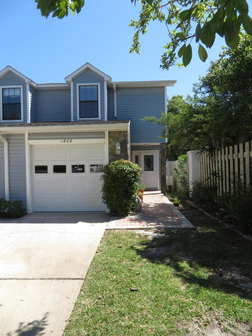 WATERFRONT HOME! This Soundfront Townhome end unit is a must see and it's move in ready. Bring your boat, as each owner has an assigned boar slip. Don't let age of home scare you as it was mostly rebuilt in 2007. This neighborhood is a great location for all who enjoy waterfront living and natural beauty of the Florida Panhandle. First floor has tiled floors with all new kitchen, mostly new white appliance, breakfast bar, granite countertops, custom designed tile backsplash and maple cabinets. Custom cabinets include soft close drawers, corner carousel and pull out spice holder. Great room with fireplace which opens into the Sun Room. Sun Room has direct access to adjacent pool and custom commons paver promenade which stretches parallel to the Santa Rosa Sound the length of the townhome