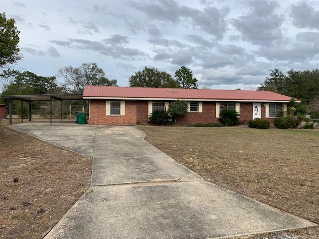 Welcome Home! ~ 4 bed ~ 2 bath ~ 1 acre corner lot ~ Kitchen w/Breakfast Area ~ Bonus Room/Den ~ Florida Room ~ Spacious laundry room ~ Fenced back yard ~ Storage Building