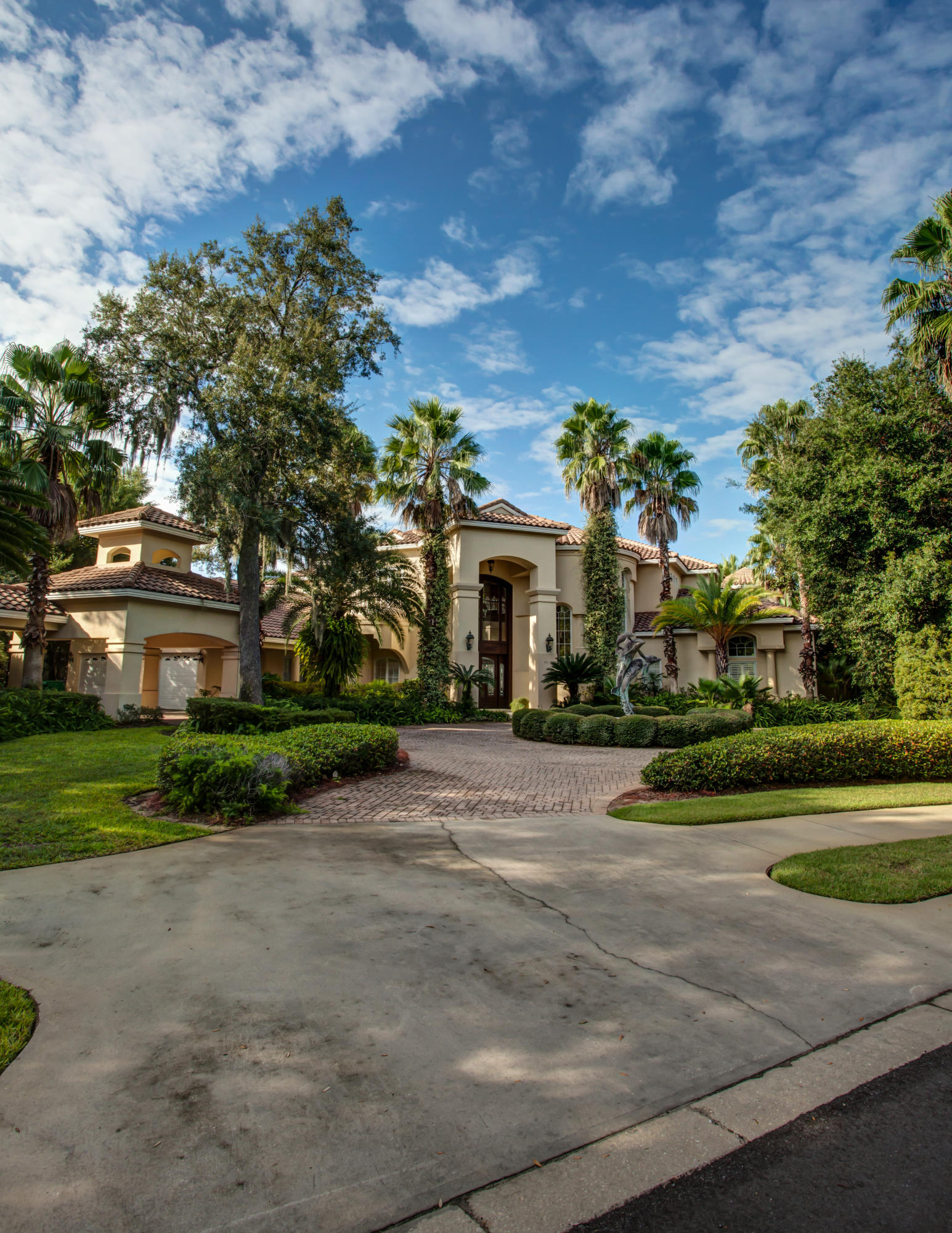 This magnificent waterfront estate combines elegance with eminent livability! Set on the deep-water of Indian Bayou on the Choctawhatchee Bay, in Destin's gated, master-planned country club and golf community known as Kelly Plantation, this award-winning home (prestigious Aurora accolades) presents the perfect backdrop for both fabulous entertaining and a relaxed Florida lifestyle. The 2-story entry opens to a grand foyer with gleaming marble floors, large granite-topped bar, and curving staircase with iron-wrought railings. The inviting view of the beautiful patio and pool and the sparkling waters of the bay draws the eye, as does the 400-gallon aquarium that separates the formal living and dining rooms. Built by Bill Johnson and designed by the Evans Group, a nationally acclaimed firm...