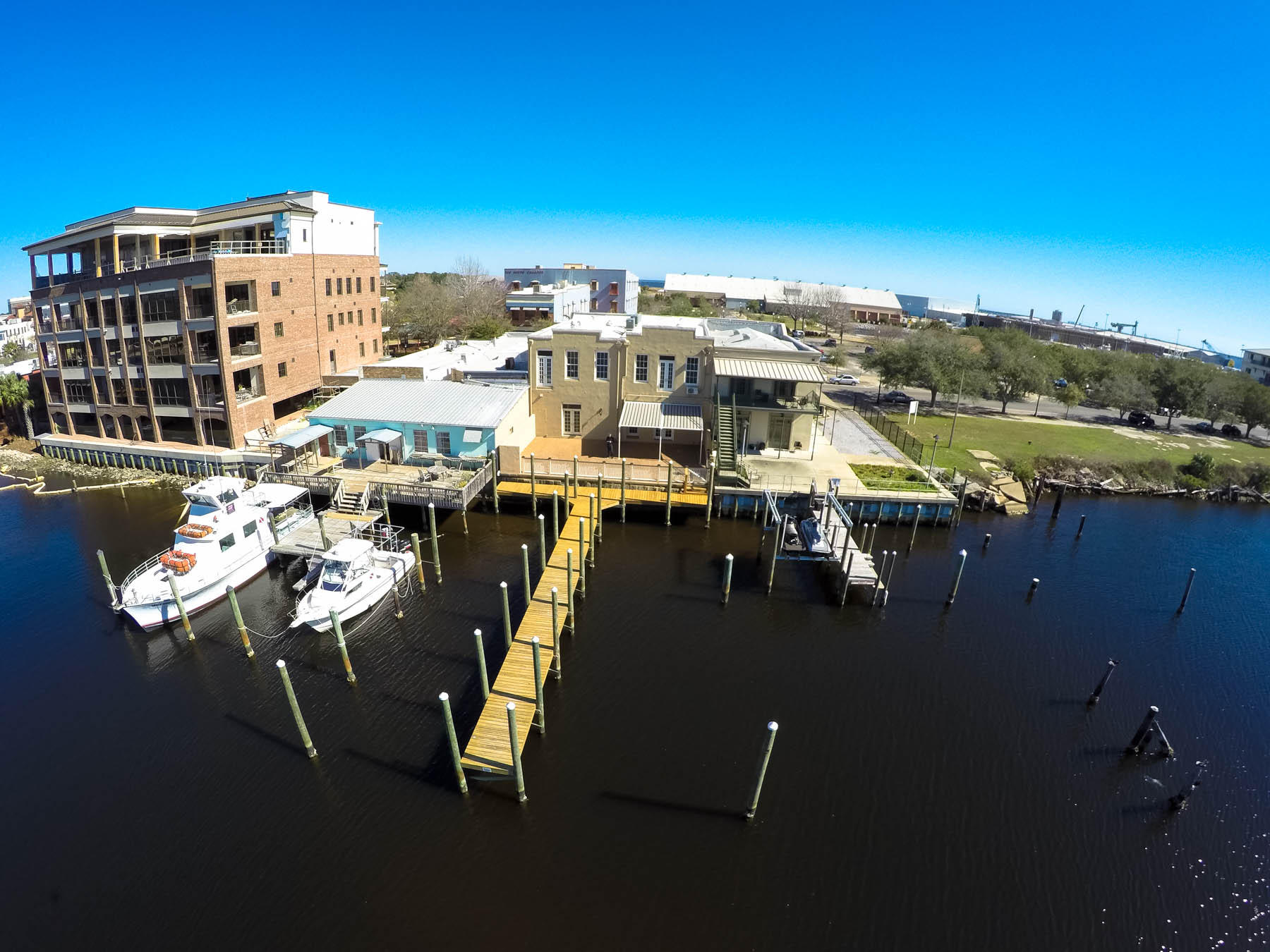 5,734 SF waterfront office space with 70' dock and two 65' boat slips. Office space was completely renovated in 2001 with continued updates. Floorplan consist of seven private offices, two conference rooms, four restrooms, server room and shared workspace (see floorplan attached). Private parking includes 12 parking spaces with potential for development.