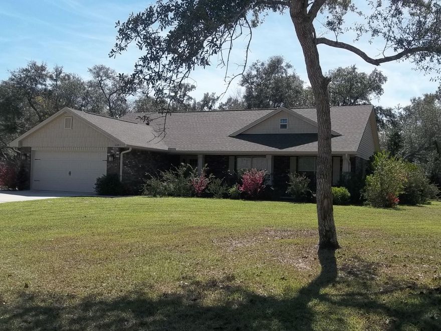 Beautiful Home in Tom King Estates on a cul de sac. What a Find! Rare opportunity to live in Paradise. Convenient to Hurlburt Field and Pensacola NAS. Close to Navarre Beach and Pier. Almost New Adams Home with Granite Counters and Stainless Appliances. A Covered Front Porch Greets Your Guests. You Enter into a Wide, Spacious Foyer that Opens to the Living Room and Kitchen. Kitchen is well appointed and even has a Breakfast Bar! Fantastic views of the Backyard from the Dining and Living Areas. Backyard with Lovely Dappled Light is perfect for Grilling and Gatherings. Split Bedroom Plan. Master Bath has Separate Tub and Shower. Walk-In Closet. 4th Bedroom can be an Optional Office. Come Home to 6883 Gasper Court. Come Home to Relaxation!Buyer to verify measurements.