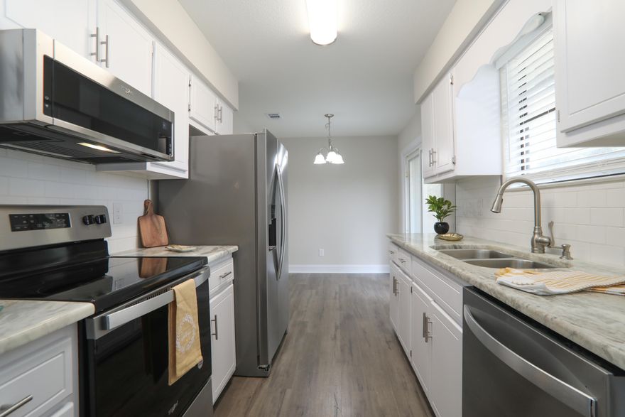 5k credit to buyer at full price offer! 100% remodeled! 100% Updated !!!New Roof 7/2022, New HVAC & Water Heater 2022. 3BD, 2 BA Home with 1841 SF, 1C Carport home with fenced yard on .29 Acres. Kitchen has been updated with new granite, New Stainless Steel Appliances, New lights and Laminate flooring. New Paint inside, New laminate in main areas, Carpet in bedrooms and Luxury Vinyl in bathrooms and Laundry. Inside Laundry. Newly Updated bathrooms. Covered back Deck/Porch 11x21. Room sizes approx. buyer to verify.