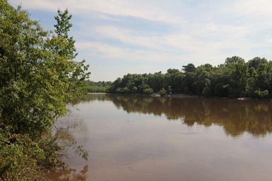 One of the most magnificent properties in the Panhandle. This 202 acre tract has everything you could ever ask for in a property. There is over 2000 feet on the Choctawhatchee River and over 2900 feet on a large creek that runs into the river on this tract of land. Also on this beautiful tract is a three acre lake situated in the center of rolling pasture and crop land. The pasture land has over a dozen majestic oaks scattered across it! You will have your own private boat launch located on the creek just a few yards from the River! There is also a 1232 square foot, 2 bedroom, 1 bath home that has recently been renovated and has a metal roof. This house would make the perfect hunting camp or get a way retreat! The property is loaded with deer, turkey and ducks! Artesian Well on Property.