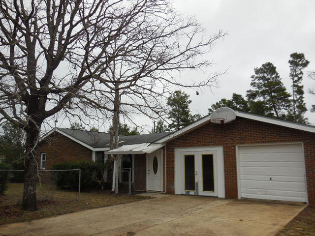 Great diamond in the rough home for a growing family. This home features 3 bedrooms and 2 full baths. The garage was partially converted into a den which could also be converted into a 4th bedroom! Living areas include a living room, a family room with a ''pot bellied'' stove, and an enclosed patio out back. The kitchen and the dining area round off the rooms. There is a large back yard and a extra fenced front yard.