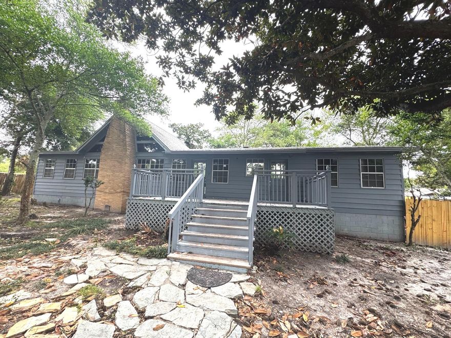 If you have been looking for a ski chalet in Destin, your search is over!  Priced to make your dreams come true, owning the property at 431 Benning allows you to take your boat from your own front yard to the Bayou just a few blocks north.   At 15,000 square feet, this deep front yard is not governed by an HOA, so let your creativity loose! Also note you are just  five blocks north of the Harbor and two blocks from Destin Elementary. Enclosed porch on west side of property is not included in the heated/cooled square footage.