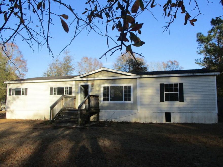 This HUD REO home is located just a few minutes off of the Hwy 87 I-10 exit making this one just a short drive from Downtown Milton, Navarre, or Pensacola. Built in 2007, this split bedroom design 3 bedroom 2 bath mobile home has vaulted ceilings, fireplace, kitchen island and tons of potential. A certain must see to appreciate. Call today to schedule your appointment. Property is FHA insurable (IE).