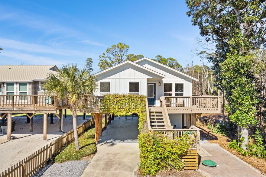 ACCEPTING BACK-UP OFFERS! Welcome to Honeysuckle Beach Cottage, a charming coastal retreat offering 3 bedrooms and 2 NEWLY REMODELED  bathrooms on the main level, with an additional separate studio downstairs. This NEW studio includes a cozy bedroom, full bathroom with a standing shower, refrigerator, and a relaxing sitting area. This property is all about location, location, location, as it is across the street from Shellseekers Public Beach Access which is just one block south of Highway 30A. Shunk Gulley and Gulf Place are only a couple of blocks west, offering plenty of dining, shopping, and entertainment options. With NO HOA fees and ample parking for guests, this home is perfect for both rental potential and as a primary or secondary residence. Set high on pilings, the property features a spacious wraparound balcony and additional sitting areas underneath, providing plenty of outdoor space for relaxation and entertainment. The kitchen has quartz countertops and pendant lighting above the breakfast bar, and a formal dining area with lots of natural light flowing into the home. There is also an outdoor shower for rinsing off after a long day at the beach.  If you've always dreamed of living on 30A, this is the perfect opportunity to own your very own beach cottage in an incredible location!