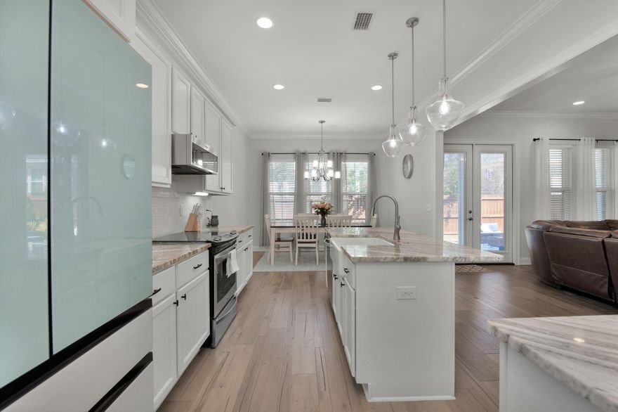 **SELLER WILL CONTRIBUTE $10K TOWARDS RATE BUYDOWN OR CLOSING COSTS!**Why buy new when you can have all the upgrades in a newer home? This beautiful, all brick home is located in the sought after neighborhood of Deer Moss Creek. The property features 4 bedrooms and 2.5 baths with a downstairs master bedroom. As you enter the home you will enjoy the open floor plan looking into the living room with its upgraded marble gas fireplace surrounded by floating shelves as well as built in cabinetry. The kitchen has been updated with a new backsplash, refrigerator (2022) and microwave (2022) while the pantry has been given a fresh breath with custom cabinetry to increase storage. Dreading to do laundry? Not in this laundry room!