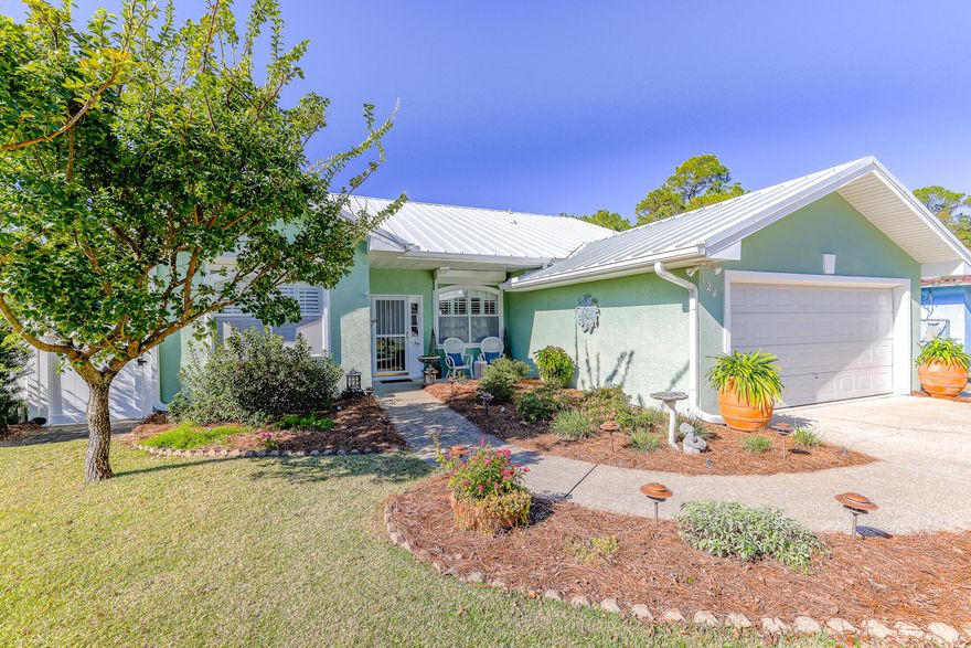 What a wonderful home only a few blocks to the beach! This home is one of our new Favorites. It has so many awesome features such as a large open floor plan, a beautiful kitchen with silverstone quartz counters & breakfast bar, stainless steel appliances, a master suite which opens to the grand sunroom, a bonus room currently being used as a dining room, tile throughout the entire home with the exception of Sunroom.There is also a screened in porch off of the sunroom. The exterior boasts of low maintenance fencing and decking,seamless metal roof ,hurricane shutters,a 10x12 storage building,double car garage,sprinkler system and a beautifully landscaped yard. Wow this is a magnificent home! NO HOA! The location is brilliant.great access to the beach,Pier Park,30 A corridor & more. Come see