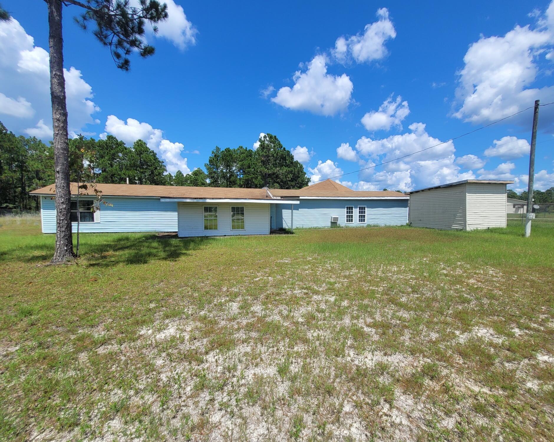 6.95 ACRES!! Distressed structure nestled on desirable lot in Freeport. A large section of the lot is cleared, and the other portion is wooded. Detached shed. Large 2 car garage/workshop area. Large living room. Spacious bathrooms. Open kitchen. This property is distressed. Would be a great project home for the handy homeowner, or a tear down to make room for your dream home! Vacant and easy to show. See agent notes regarding Parcel and survey information.