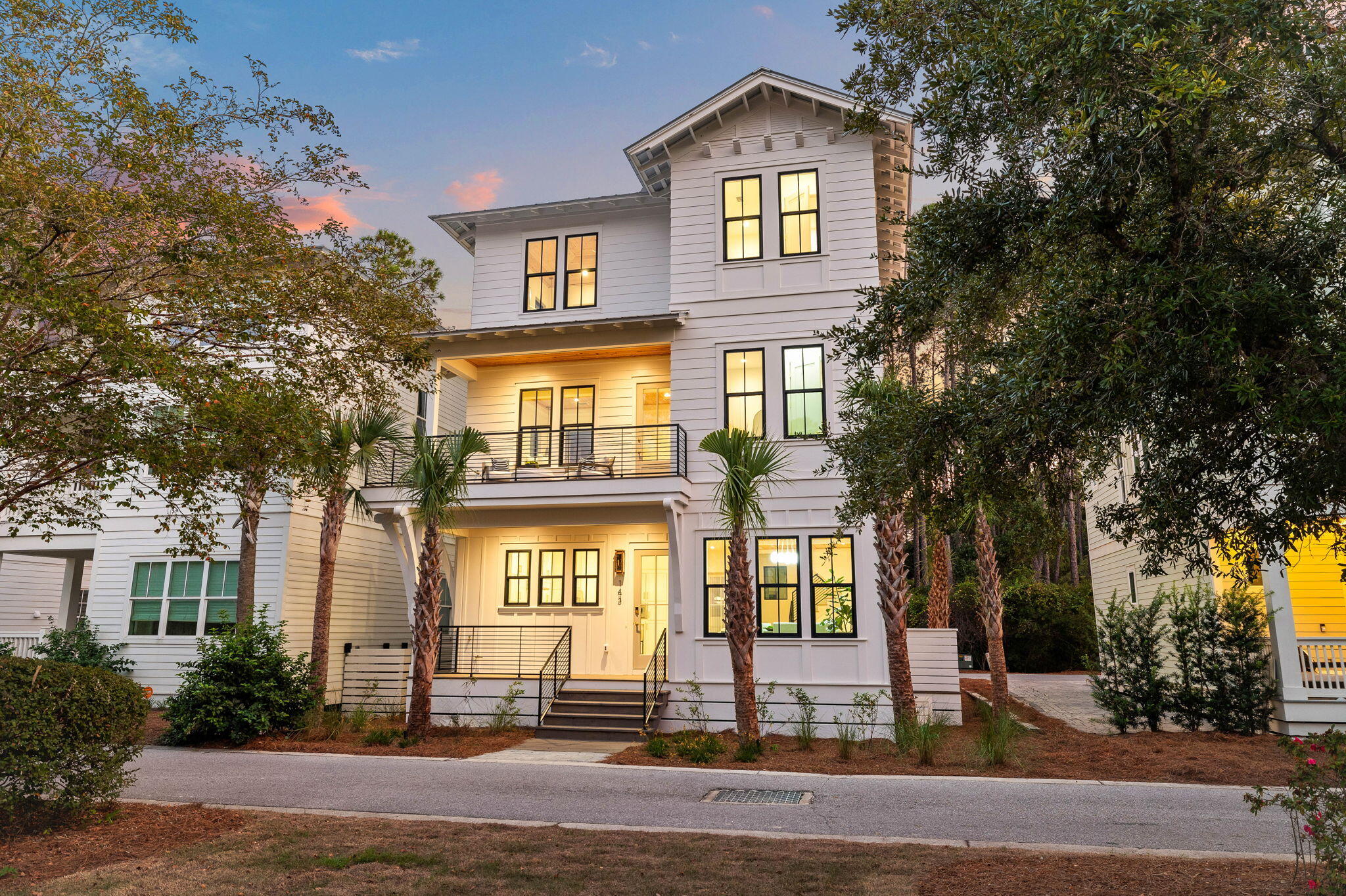 This stunning new construction home in the exclusive, gated Treetops neighborhood of Inlet Beach offers a blend of luxury, comfort, and coastal elegance. Designed by Gregory Jazayeri, this 3,217 square foot home spans three levels and features deeded beach access with seasonal tram service to and from the beach, offering both convenience and tranquility.Upon entry, the first floor welcomes you with an open-concept kitchen, living, dining, and family room, showcasing cypress accent ceilings that enhance the home's inviting atmosphere. The gourmet kitchen is a chef's dream, equipped with high-end Thermador appliances, a spacious island with a waterfall edge, custom cabinetry, a full-height backsplash, Delta plumbing fixtures, and elegant brass hardware. A powder room is conveniently located for guests, while the epoxy-finished garage provides ample parking and storage.
The second floor serves as a private retreat, featuring a serene primary suite with a private balcony, a large walk-in closet with custom built-ins, and a spa-like ensuite bathroom. Two additional bedrooms, each with their own ensuite baths, and a nearby laundry room offer both comfort and functionality.
The third floor includes a versatile family or entertainment room, perfect for gatherings or quiet relaxation. The custom bunk room sleeps four, complete with built-in bunks, integrated storage, and stylish brass hardware. A second primary suite on this level boasts a vaulted wood accent ceiling, a luxurious ensuite bath, and a garden-style tub.
This home is filled with upscale finishes, including solid core doors, European hardwood floors, floating vanities with under-cabinet lighting, and PGT windows. Outside, professionally designed landscaping and landscape lighting enhance the home's curb appeal. Residents enjoy deeded beach access, a community pool, and proximity to the Seacrest tram pickup, offering the ideal balance of privacy and convenience. Located just south of Highway 98, this home is your gateway to the best of coastal living in Inlet Beach.