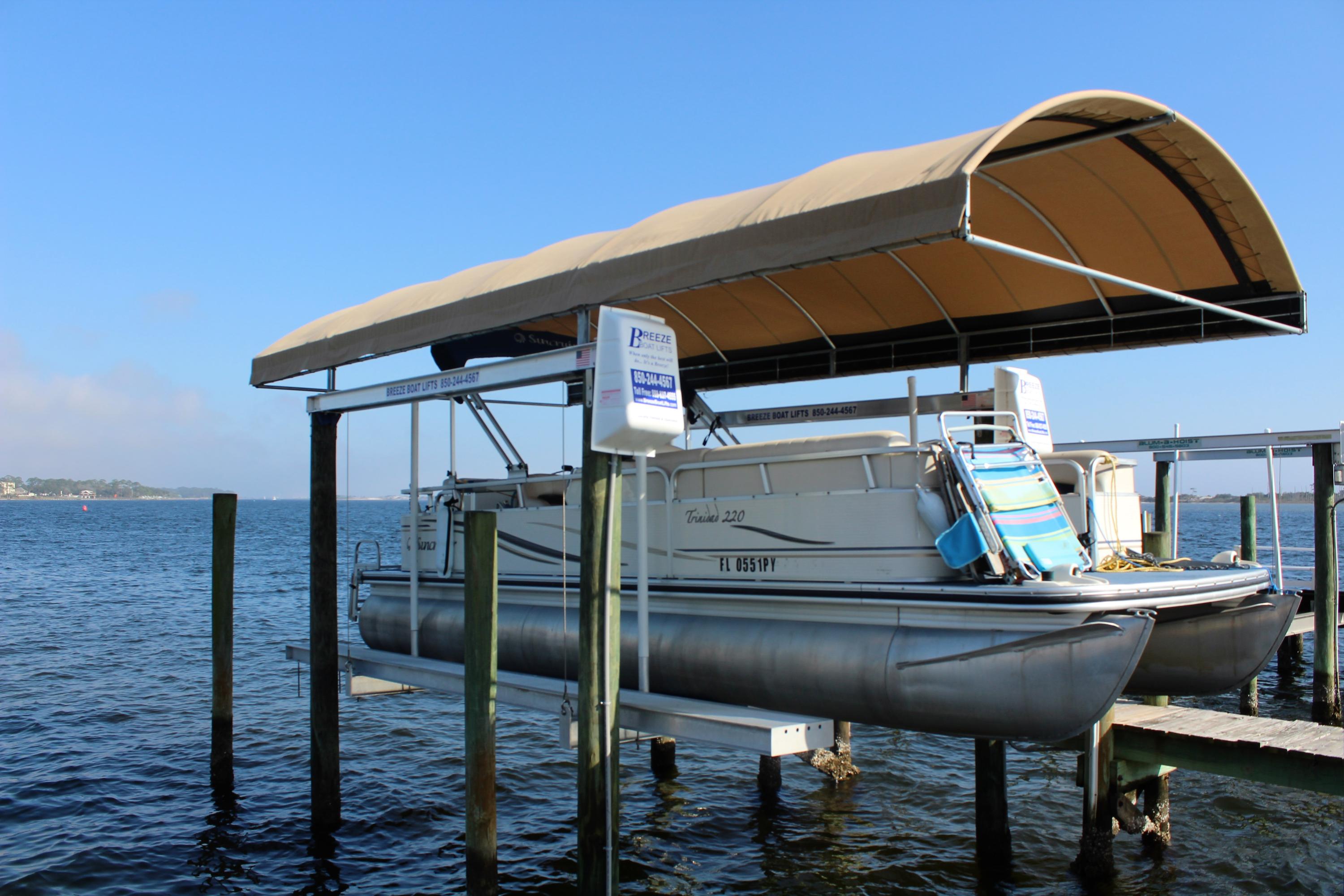 Affordable WATERFRONT END UNIT town home with COVERED BOAT SLIP #20 & BOATLIFT w/auto remote. This is a MUST see home to enjoy Florida finest!Awesome views of the sound & sunsets from 2 balconies & a covered patio. Sit on the private beach area or dip in the pool. This home has covered parking, 2 bedrooms, 3 full bathrooms, office, & a big bonus room - great for pool table or bedroom. Step inside to see beautiful hard wood floors throughout the 2nd floor. Spacious living room & master bedroom have great water views of sound & balconies. Open Gourmet kitchen with granite counter tops & stainless steel appliances (double oven & refrigerator w/ice maker). Wraparound breakfast with drop lights. Some furnishing will convey with home. MUST see photos and CLICK for more information