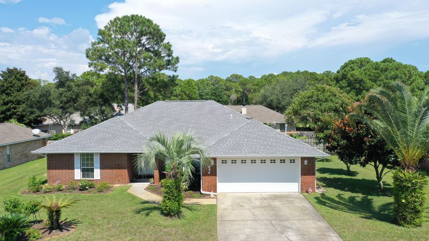 This immaculate maintained home with mature beautiful landscaping located in Bayside Community. This home is only half a mile to the Silver Sand Outlets and a 1.3 mile drive to the gorgeous white sugar sand beaches in Miramar Beach. As you walk through the hurricane impact front door you will notice the beautiful new laminate wood flooring, newly painted walls and updated light fixtures throughout the entire home with a large dining area. The living room includes vaulted ceilings and a remote-control gas fireplace with a stunning cypress wood trim all around it. The attractive well-spaced kitchen has new black stainless-steel appliances, gas cooktop, white quartz counter tops with a quartz farmhouse kitchen sink.