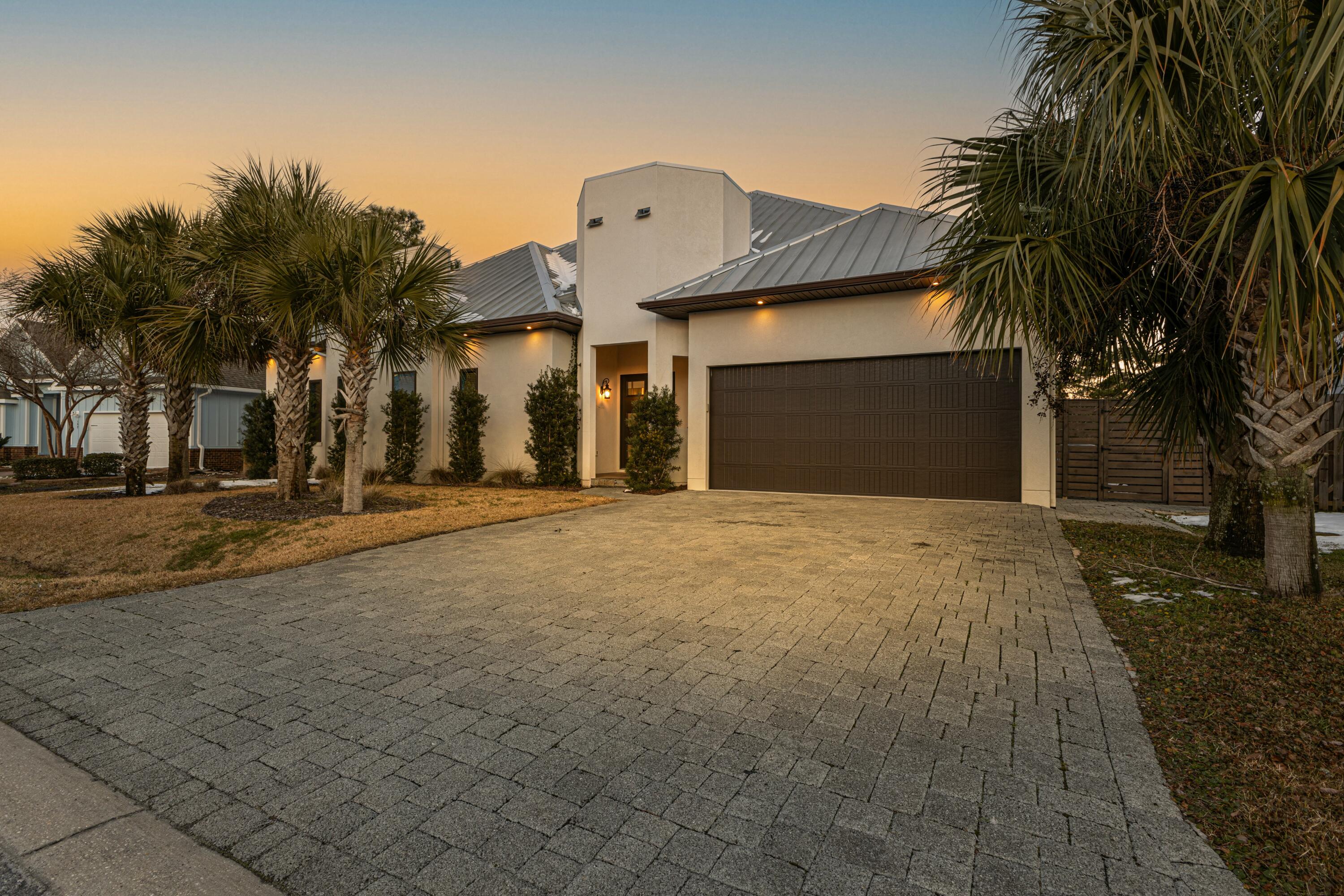 Welcome to this stunning custom home in the highly desired gated Cypress Breeze Plantation Community, just off the iconic 30A. Nestled against a serene tree-lined preserve, this one-story, open-concept home offers privacy, luxury, and convenience. Featuring 12 and 16 foot cathedral ceilings, large windows, and exquisite craftsmanship, the bright living and dining areas are perfect for entertaining. The chef-inspired kitchen flows seamlessly into the grand living spaces and generously sized bedrooms plus office space. The stunning beaches of the Gulf are just minutes away, as well as shopping, dining, and entertainment options including Shunk Gulley and Gulf Place Town Center. Whether a second home, vacation rental, or full-time residence, this home offers the ultimate 30A lifestyle.