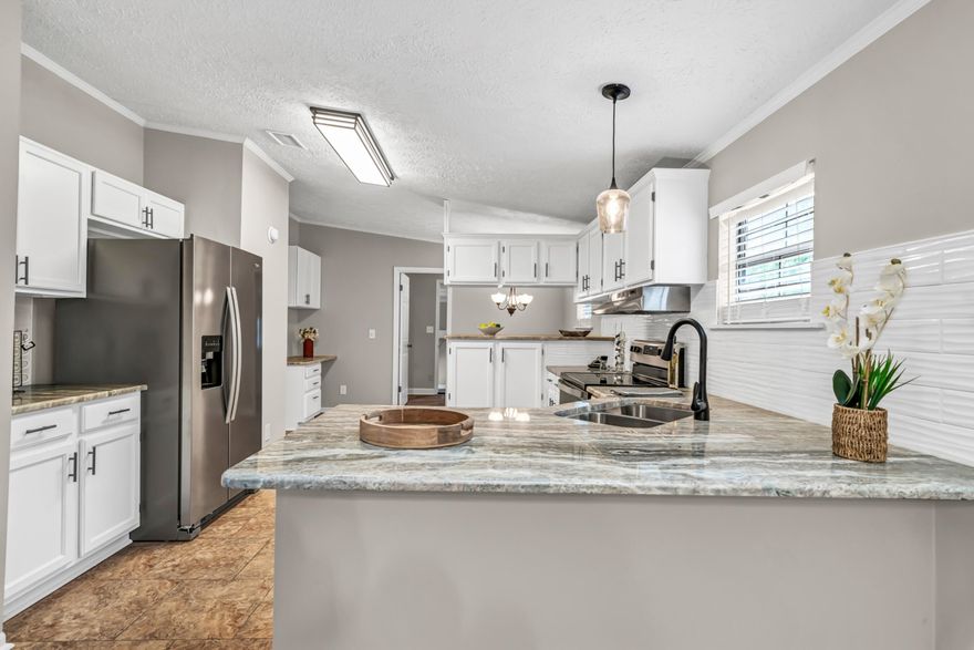 Back On market at no fault of seller--1.19 Acre Property with privacy & country living. 3 Bedroom 2 Bath Home with 2,332 sq. ft. Large master bedroom with walk-in closet.  Roof (2022) and outside AC (2022) inside Ac 2024,  hot water heaters  (2) 2024, Large Family room offering many options for use at room size of 25 x 20. Split floor plan, built-in bookcases.  Updated Kitchen with Granite Counter-tops, Backsplash, lights and New Appliances. New Fans/Lights, blinds, door knobs & Hinges throughout home. New Paint inside. Come make your appointment today!