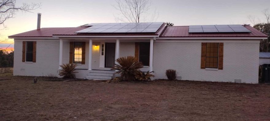 Great Deal! Natural cold water Spring fed pond-- 22.37 Acres (Nice Flat Land) with a 1583 SF Brick Home & 400 SF Open porch  Workshop with 2Car Carport and Pole Barn that is getting updated with Newer Metal Roof and working electric. 2018/2019 4 Ton Tram AC/Heat Unit. 2019 Roof & Solar panels with 25 yr. warranty, 2019 hot water heater. Well & Septic inspected & in working condition. Painting Inside & Out, New Carpet in bedrooms, New Luxury Vinyl in Bathrooms. Some repairs to back porch. Seller has Survey. Home needs cosmetics only!! . NO HOA