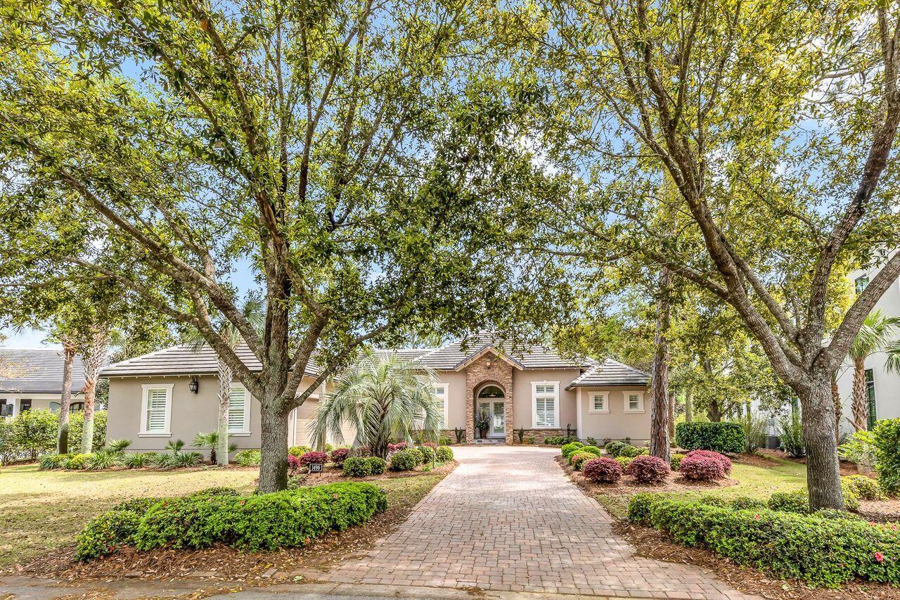 Estate sized lot located in the highly sought after community of Island Green, Sandestin Resort, This stunning one level home is freshly painted and recently updated, (HVAC 2023), features a zoned spacious primary suite with sitting area, ensuite bath, custom walk in closet, and access to the beautiful pool and Lani. Designed for entertaining this lavish entry, dining and living area with modern stainless adorned fireplace and rich hardwood flooring will capture your attention as well as the georgeous view of the lani and lush landscaping that surrounds the home. The heart of a home is the kitchen and this one is fabulous, an abuidance of warm cabinetry topped with quartz, updated appliances, island with prep sink & breakfast bar opening into an additional living area with pool acce