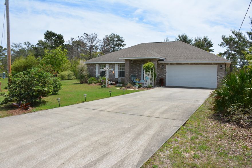 Must See this like new contemporary 3BR/2 BATH, 2 car garage home nestled on a quiet cul-de-sac lot gives the feel of quaint cottage living. Walking distance to inter-coastal waterway with public access to Woodlawn Beach boat ramp. Pensacola South College just minutes away! Approximately 20 miles east to Hurlburt Field military base. Perfect location for those who work in Pensacola. Home feels much larger with high ceilings with neutral tile and color throughout the home. Large master bedroom with trey ceiling, double vanity in master bathroom and a walk-in master closet. Additional bedrooms are good size, each with ample closet space. This home is ideal for a young family with children or a couple looking to downsize, easy maintenance and upkeep.