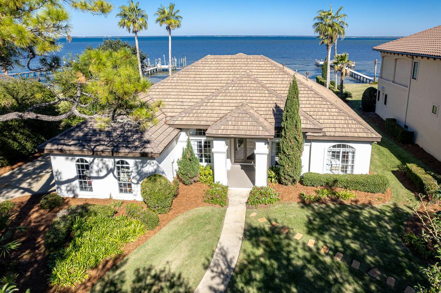 JUST REDUCED! REMODELED & FURNISHED Bayfront Home located in the exclusive community of Kelly Plantation in Destin, Florida! Measuring approximately 2,910 square feet of conditioned space and containing (5)-bedrooms and (3)-baths, this home will accommodate you and your guests as a wonderful primary homestead, or perhaps a secondary home to enjoy peace and serenity. Its lushly landscaped lot expands approximately 102' along the scenic bay shores of the Choctawhatchee Bay, while the estate-sized lot contains nearly a quarter of an acre. The dock and lift will accommodate various boating vessels and jet skis, and is in proximity to the famous Crab Island at the East Pass, which connects the bay to the Gulf of Mexico. Coupled with the spectacular amenities within the gated community of...