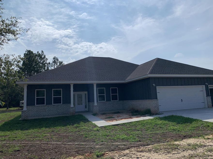 Don't miss this Custom Built Home on over 1.5  beautiful acres in Baker