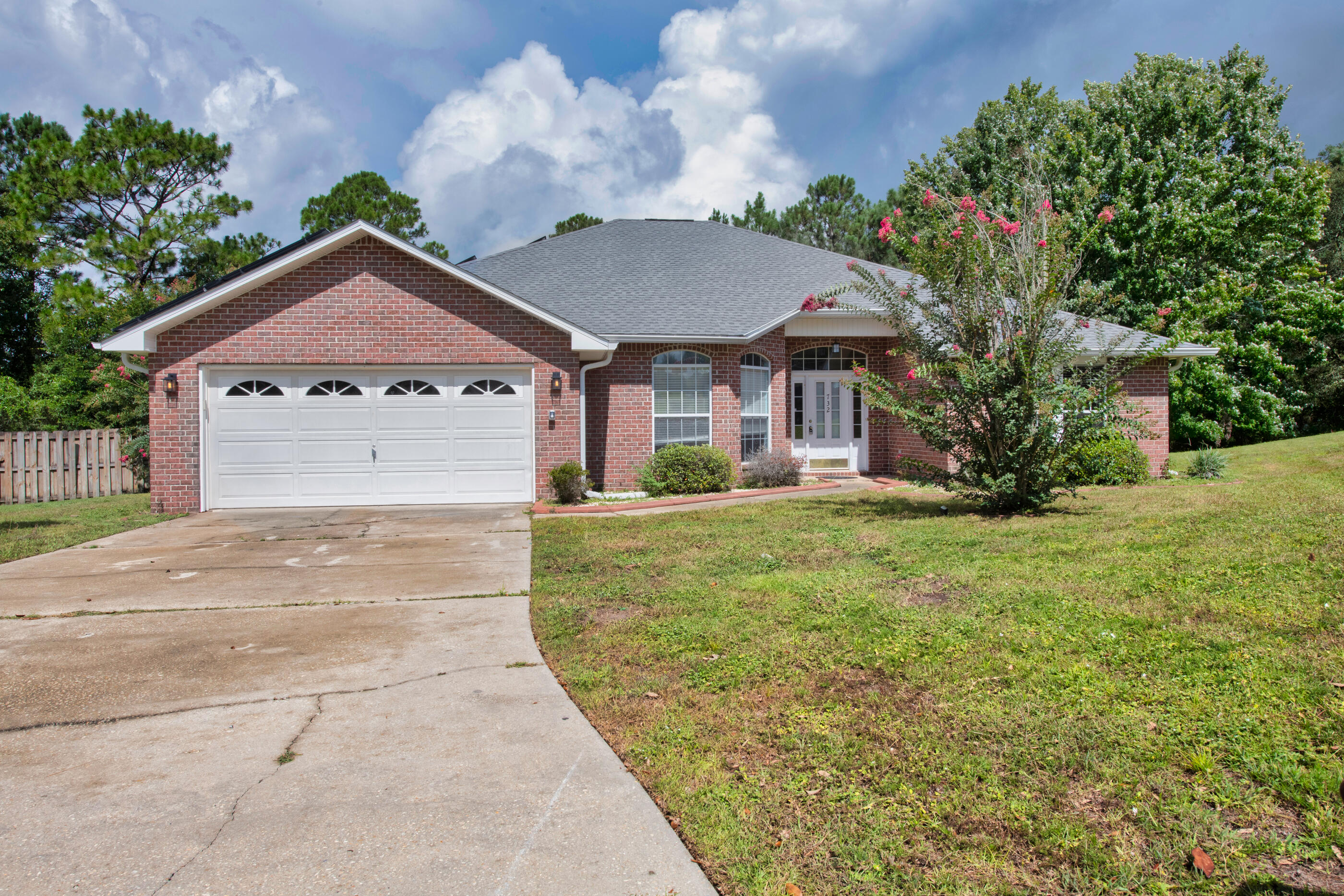 *Solar Pnls Paid Off & Assumable Home Loan 2.99%* Tucked away at the end of a quiet cul-de-sac in Southwest Crestview, this brick beauty offers privacy, space, and no HOA! Inside, you'll find a smart split-bedroom layout, ideal for keeping the master suite separate from the guests or kids. Need a home office? One of the front bedrooms features elegant French doors & fits the bill perfectly.The bright, open living and dining areas are filled with natural light, creating a warm, welcoming vibe throughout the day. The master suite features a large walk-in closet, split vanities, a garden tub with jacuzzi jets under a stunning window, a separate shower, and a private 'throne' room to keep things tidy. Step out back to your own personal oasis; a fully enclosed patio with an in-ground pool. Screens will be repaired with an acceptable offer, and the pool will be sparkling and ready for when you move in. Solar panels are paid off and virtually cover the whole left side of the roof (installed 2020, transferable 10-year warranty) to help reduce those rising electric bills. With a newer roof (2022), well maintained HVAC (2016) and tankless water heater, and fresh paint throughout, this home is move-in ready and built for comfort.