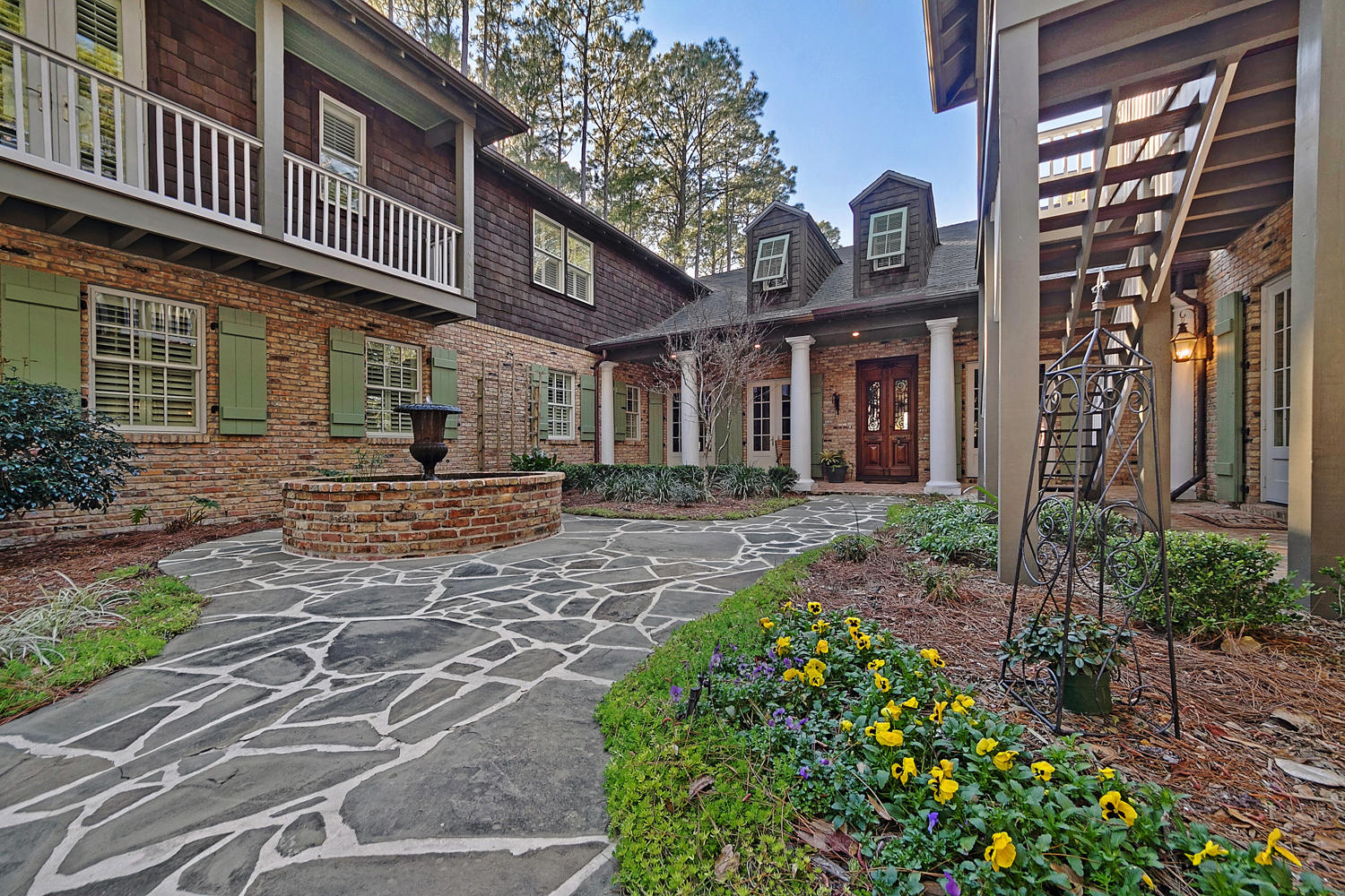 This one of a kind amazing New Orleans style majestic estate sits on the Choctawhatchee Bay on 1.1 acres and faces due west to capture breath taking sunsets. The 6,241 sq ft home features old Chicago brick walls and floors, antique doors and copper gutters. The long circular drive leads you to a charming courtyard that is ringed with balconies. Stroll past the gold fish pond to the dramatic front entrance. The master suite on the first floor, with it's own sitting room, offers stunning Bay views with soaring beams and trayed ceiling. The master bath even has it's own private garden. Entertaining will be a breeze in your gourmet kitchen with upscale appliances. Upstairs features two large bedrooms, media room and a bonus room. Guest house has two bedrooms.