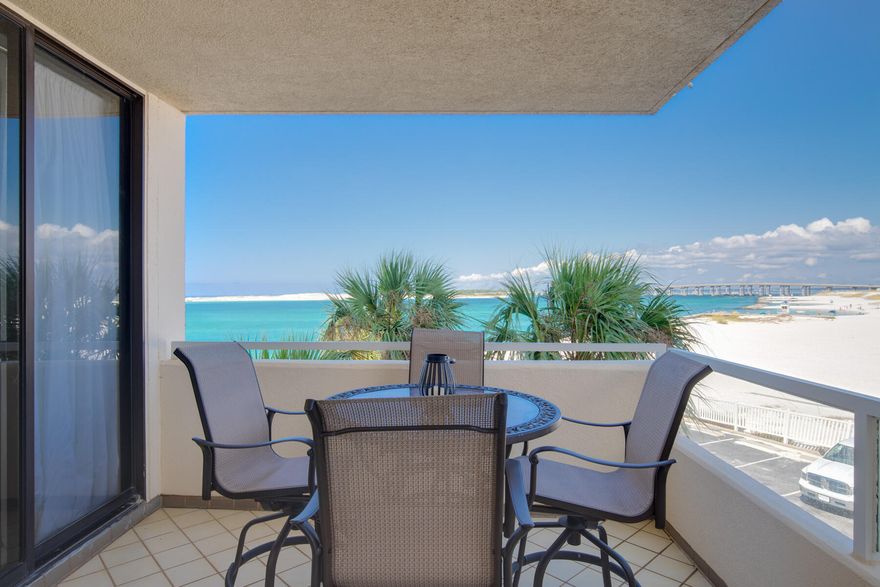 Welcome to the best view in Destin.  This beautifully updated condominium offers unsurpassed panoramic views of the East Pass, Gulf and Harbor.  From your oversized balcony, with access from the living room, guest and master bedrooms, enjoy incredible sunsets, the fishing boats passing by, dolphins playing in the Pass or the night lights from the Harbor.  Inside the open floor plan includes light, bright coastal interiors with extra large travertine like floor tile throughout, updated kitchen with stainless appliances, soft close cabinets/drawers, granite counter tops, full size washer/dryer and so much more.  This condo has not been on a rental program and is very well maintained and appointed but has the potential to be a rental machine.  East Pass Towers is situated in in the heart of Destin on Holiday Isle overlooking the famous Destin Bridge, Destin Pass, Destin Harbor, the Jetties and Gulf of Mexico and is the perfect location for you, your family and guests to fall in love with and make memories that last a lifetime.  The community amenities includes a beachside pool/hot tub, community fitness room, marina and a gated entrance. This condominium is being conveyed fee simple warranty deed and the seller can not close before 12/3/2021.