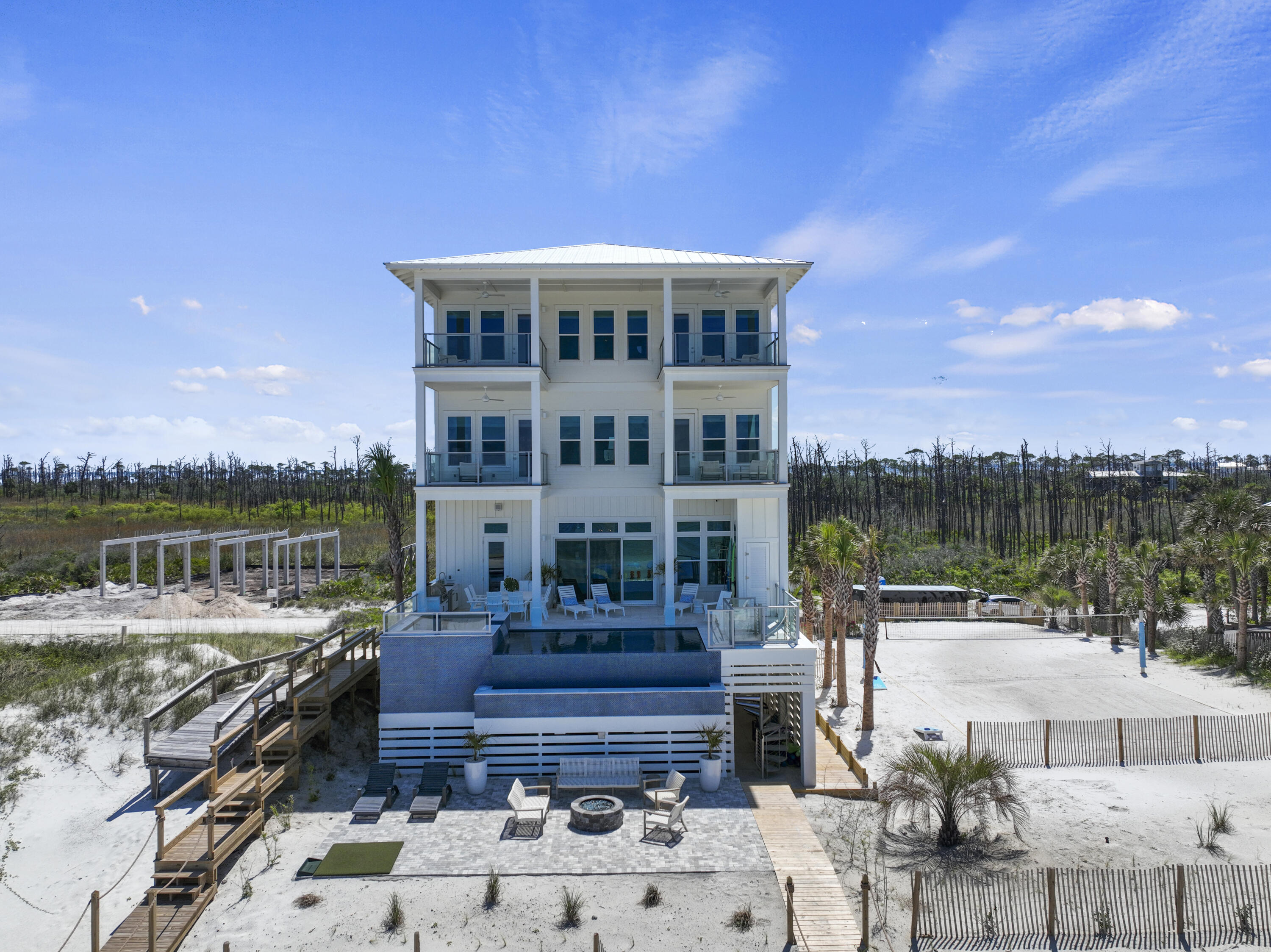 Seller Financing Available! Welcome to 'Making Memories on the Cape'. Prominently placed in the gated luxury community of Secluded Dunes, this home is perched at 30 feet above sea level encompassing 56.8 feet of gulf frontage. This home offers resort-style amenities, breathtaking views and finishes, commercial quality construction by a respected and local builder, and is made all the more sublime by the architectural design of a 30A architect. Boasting 9 beds, 9 full and 2 half baths, this home is equipped to sleep up to 28 people, making this a great option for those with large families and for those seeking ROI. Completed at the end of 2021, this architectural masterpiece rivals all homes along the Emerald Coast, yet provides the tranquility and the serenity we long for! INVESTMENT ALER