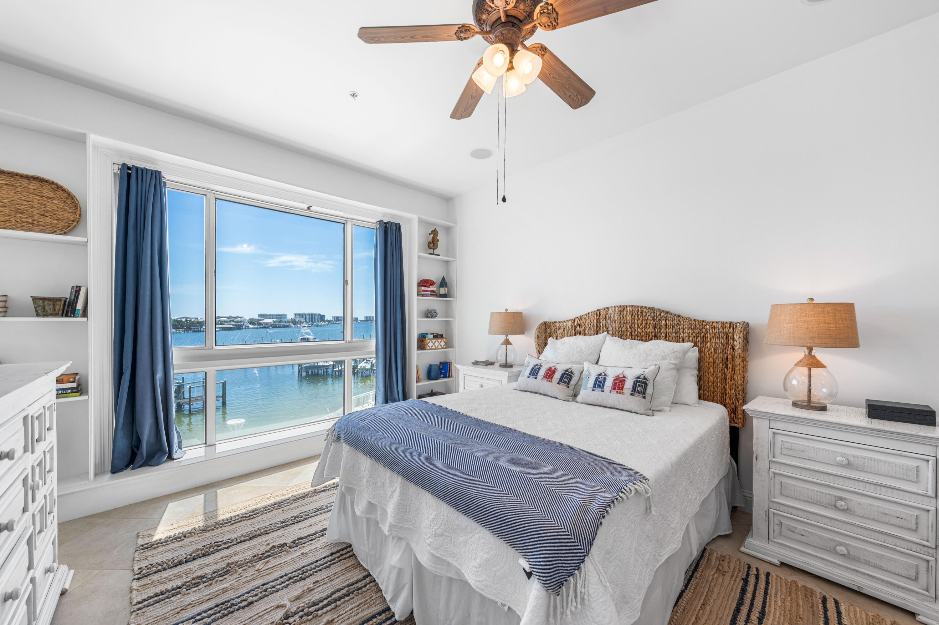 Grand Harbor sits at the front row of everything that makes Destin Harbor vibrant--fireworks, boat parades, and sunsets that define the view.Inside, ceilings soar to 9.5 feet and the layout flows effortlessly into an open living, a chef's kitchen with gas cooking, and floor‑to‑ceiling windows capture uninterrupted water views. The primary suite stretches across the harbor side with its own balcony, dual walk-ins, and a spa bath built for serious unwinding. Two additional guest suites each have full baths, with the west-facing guest suite putting sunsets front and center.Grand Harbor's no short-term rental policy keeps the community quiet and private. It's a place where you know your neighbors, mornings stay peaceful, and the harbor feels like home. Beyond your door, a heated waterfront pool and hot tub, private marina with boat slips, Tesla charging, and a fitness center are all steps away. The community also offers a clubhouse, conference center, and even a dog park. A reserved guest suite welcomes visiting friends and family, while secure gates and the parking garage create peace of mind.