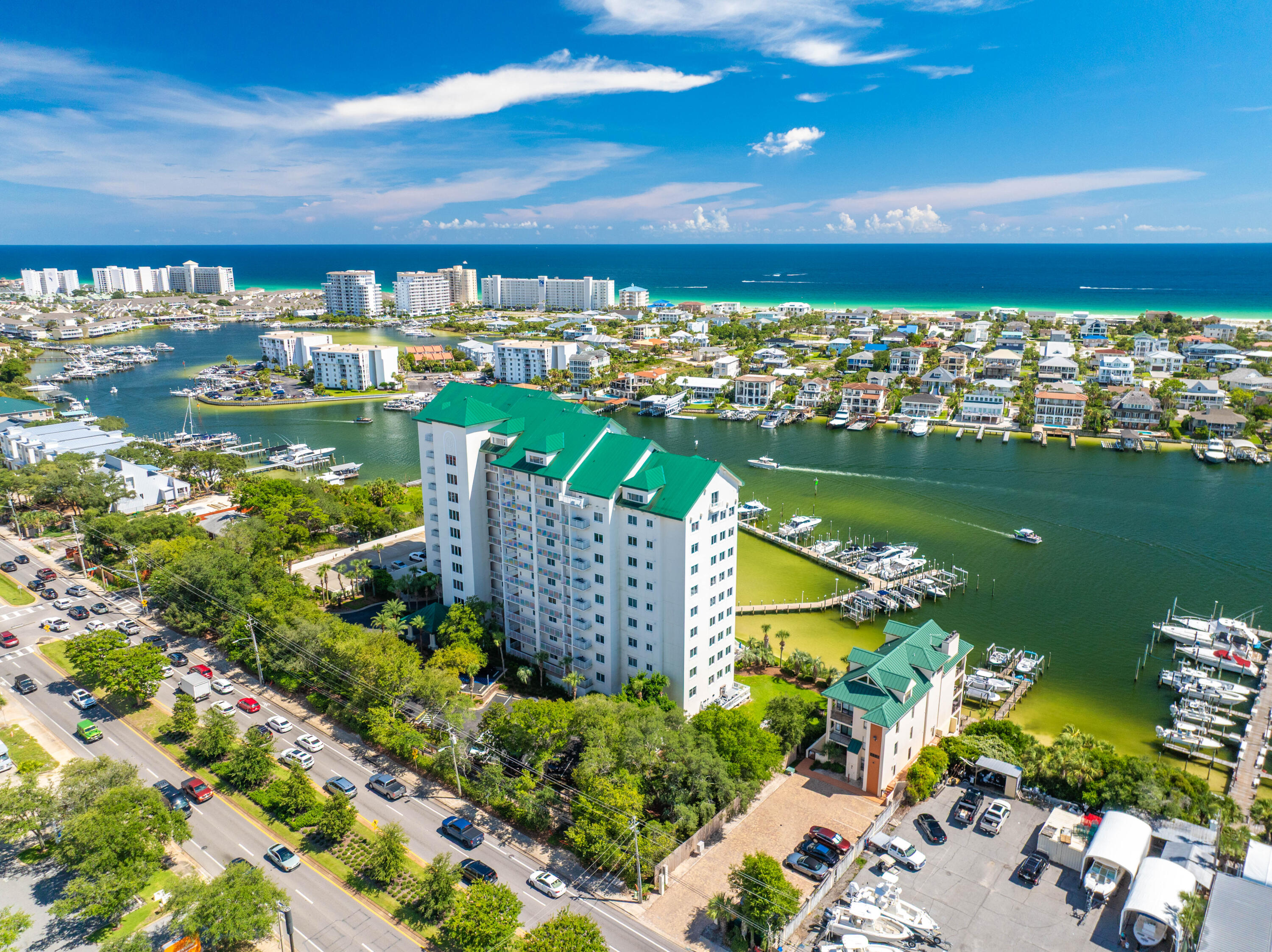 Grand Harbor sits at the front row of everything that makes Destin Harbor vibrant--fireworks, boat parades, and sunsets that define the view.Inside, ceilings soar to 9.5 feet and the layout flows effortlessly into an open living, a chef's kitchen with gas cooking, and floor‑to‑ceiling windows capture uninterrupted water views. The primary suite stretches across the harbor side with its own balcony, dual walk-ins, and a spa bath built for serious unwinding. Two additional guest suites each have full baths, with the west-facing guest suite putting sunsets front and center.Grand Harbor's no short-term rental policy keeps the community quiet and private. It's a place where you know your neighbors, mornings stay peaceful, and the harbor feels like home. Beyond your door, a heated waterfront pool and hot tub, private marina with boat slips, Tesla charging, and a fitness center are all steps away. The community also offers a clubhouse, conference center, and even a dog park. A reserved guest suite welcomes visiting friends and family, while secure gates and the parking garage create peace of mind.