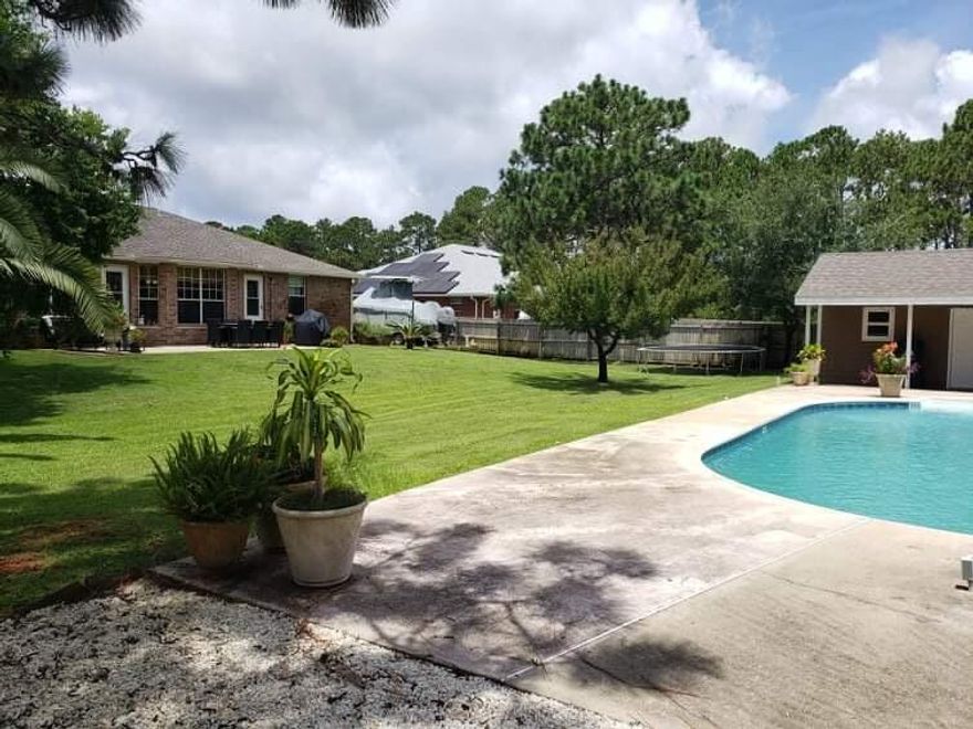 Don't miss out on this wonderfully maintained home in Holley by the Sea.  This is  4 bedroom 2 bathroom house that features a large living area and extra office or workout room.  Enjoy your evenings pool side or grilling on the back patio.  Have a boat or RV no problem, there is a parking pad for either in the back yard.  Need some extra space for storage this house has it with a large well built utility shed and or pool house.