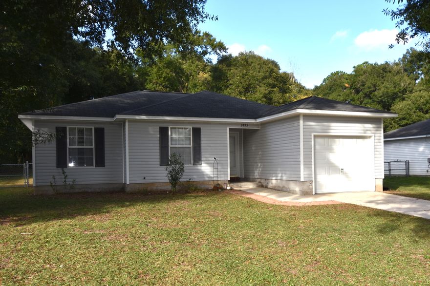 Ready to buy your first home or a great investment property? Here's your chance with a 3 bedroom, 2 full bathroom home on a LARGE level lot and fenced in back yard. NEW HVAC, 1 YR HOME WARRANTY, and CLOSING COSTS ASSISTANCE! Located in town and less than 1 mile from Walker Elementary School; less than 1/2 mile from the Movie Theater and Restaurants. Upgraded laminate wood flooring throughout and tile in bathrooms. Cathedral ceiling in living room creates a spacious feeling open to the Dining Area and beautifully renovated Kitchen! Stainless appliances, cabinetry with glass doors, and soft close drawers, pantry, and deep sink! 1 Car Garage and Open Patio. CLOSING COSTS provided by seller does not include: prepaids, inspections, escrow setup, credit report, and wire fees.