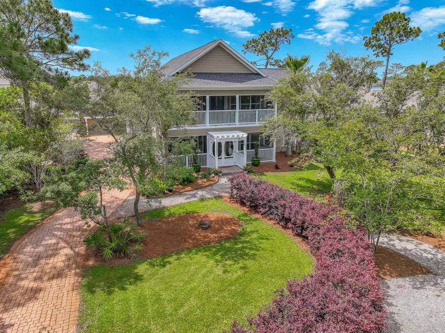 Southern white pergolas covered in jasmine, long screened in porches, whimsical transom stainglass windows and a brick paved driveway set the beautiful ambiance for this beach house. Inside, shiplap walls and designer chandeliers continue this same charming theme of nature and feminine elegance. The screened in porch upstairs with view of the bay draws you to sit outside and welcome the morning while listening to the birds or relax and reminisce over the day you and your family or friends just shared. The open floor plan and extra porch space encourages entertaining family and friends.  This property feels so private yet is within minutes of sugar white sand beaches and turquoise gulf waters. Convenient to grocery shopping, fun boutique shopping, world class local restaurants,