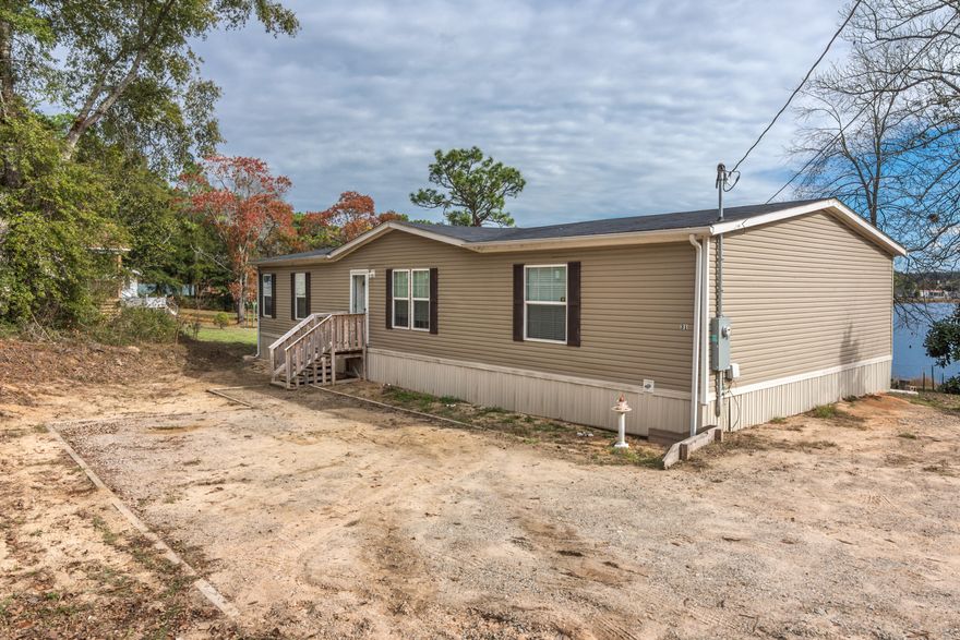 Manufactured home sitting on just over half an acre over looking Kings Lake. Walk inside to a beautiful open floor plan that is perfect for entertaining family and friends. Every room in this home is spacious and all three bedrooms feature large walk in closets. Both bathrooms are enormous and perfect for relaxing in a bubble bath! Come outside to a massive deck and enjoy a beautiful sunset with the ones you love! Have fun in the water all year long from fishing to Kayaking!