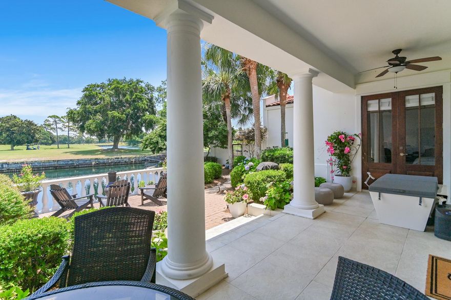 Stunning lakefront villa in gated community w/expansive views of the 8th fairway of Baytowne golf course. Resort living at its finest with a finished 2 car garage, 1st floor master suite with newly remodeled M Bath boasting double vanities, free standing garden tub, gorgeous hardwood floors, walk-in closets, and French doors leading to the covered patio and brick terrace. Generous living area with soaring 18' ceilings, abundance of natural light and an open concept into the dining area & Chef's kitchen. The second floor features a 2nd master suite and guest bedroom and perfect office space. Beautifully maintained and very lightly lived in. Patio perfect for inside-out entertaining, alfresco dining, or relaxing by the fire pit. See features for more detail!  Baytowne easily walkable.