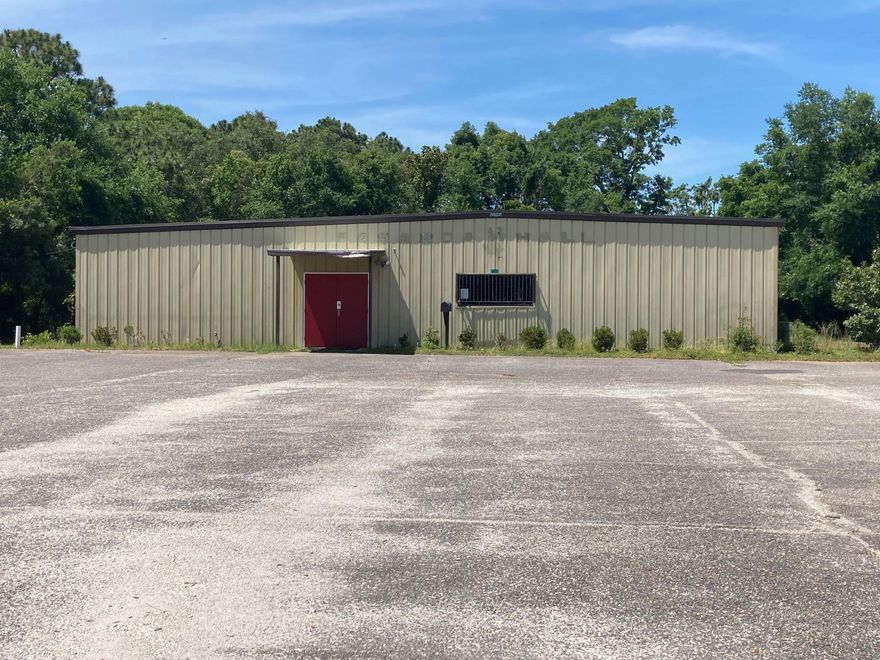 This property consist of a mostly open floorplan with heated and cooled warehouse flex space, bathrooms, storage room, and break room/kitchen. It has an oversized paved parking area with over 70 parking spaces.